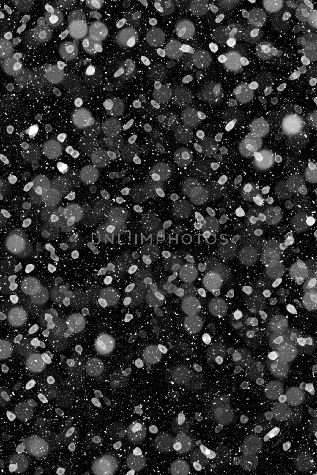 Real falling snow on a black background