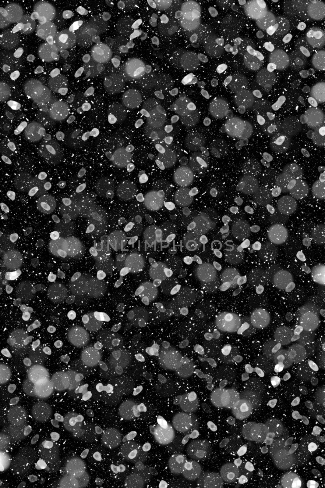 Real falling snow on a black background
