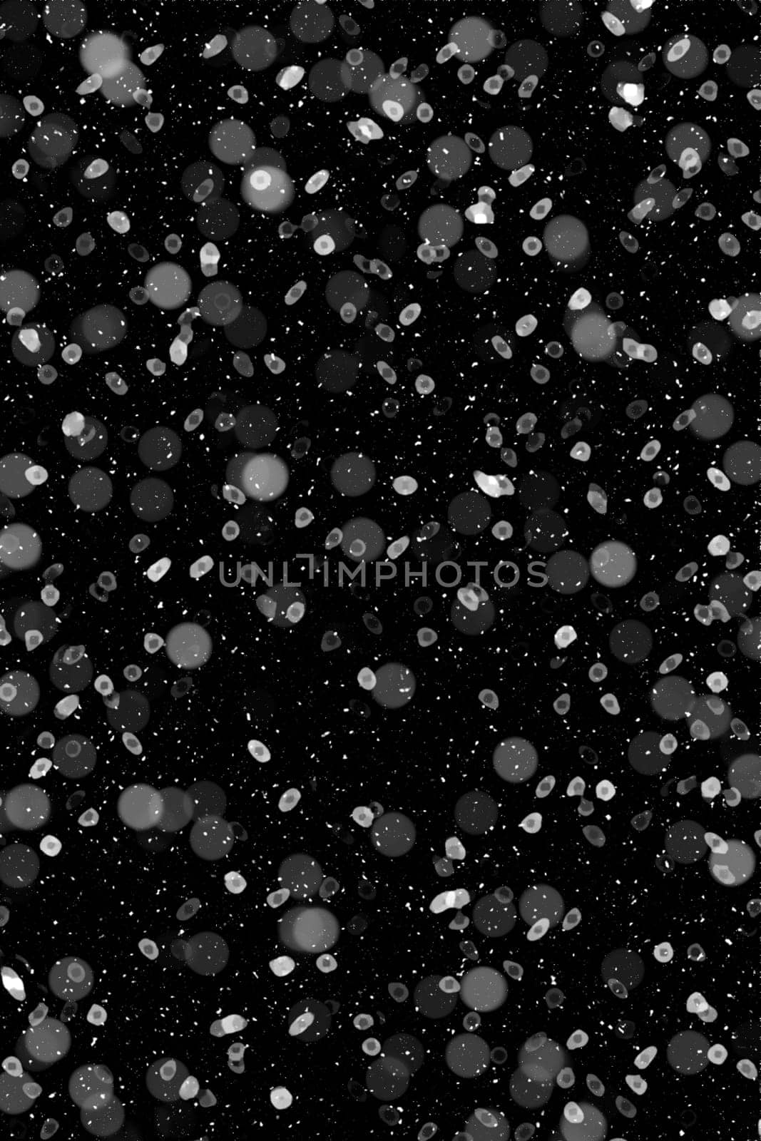 Real falling snow on a black background