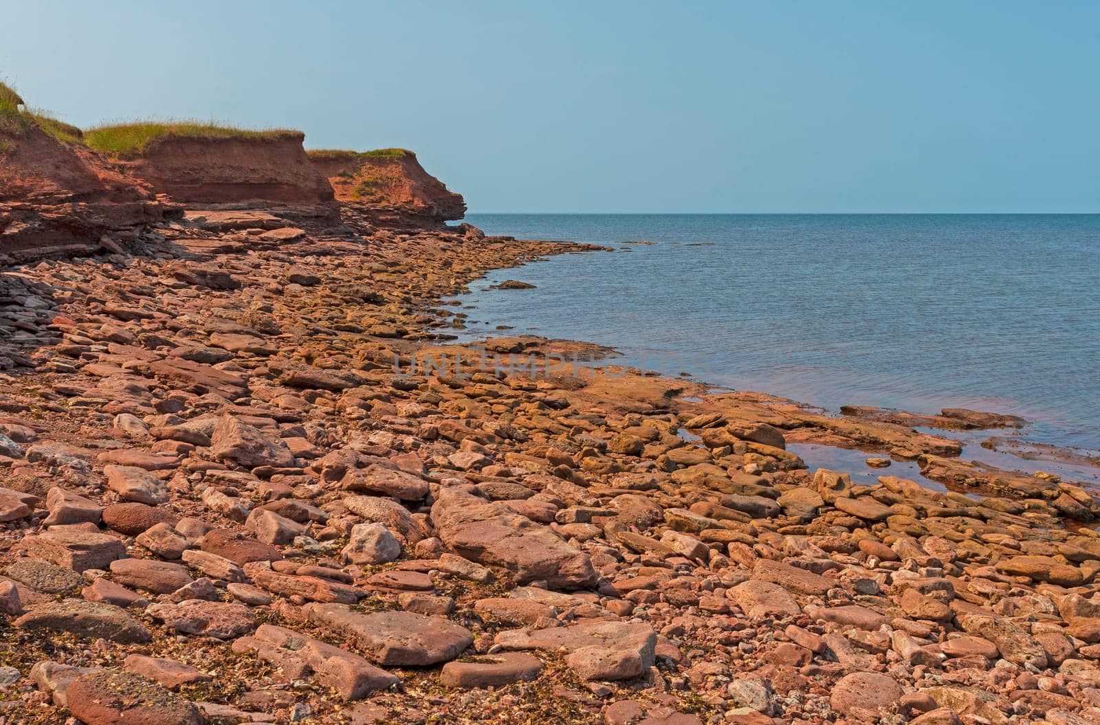 Rocky Coastline and Grassy Cliffs on The North Cape of Prince Edward Island in Canada