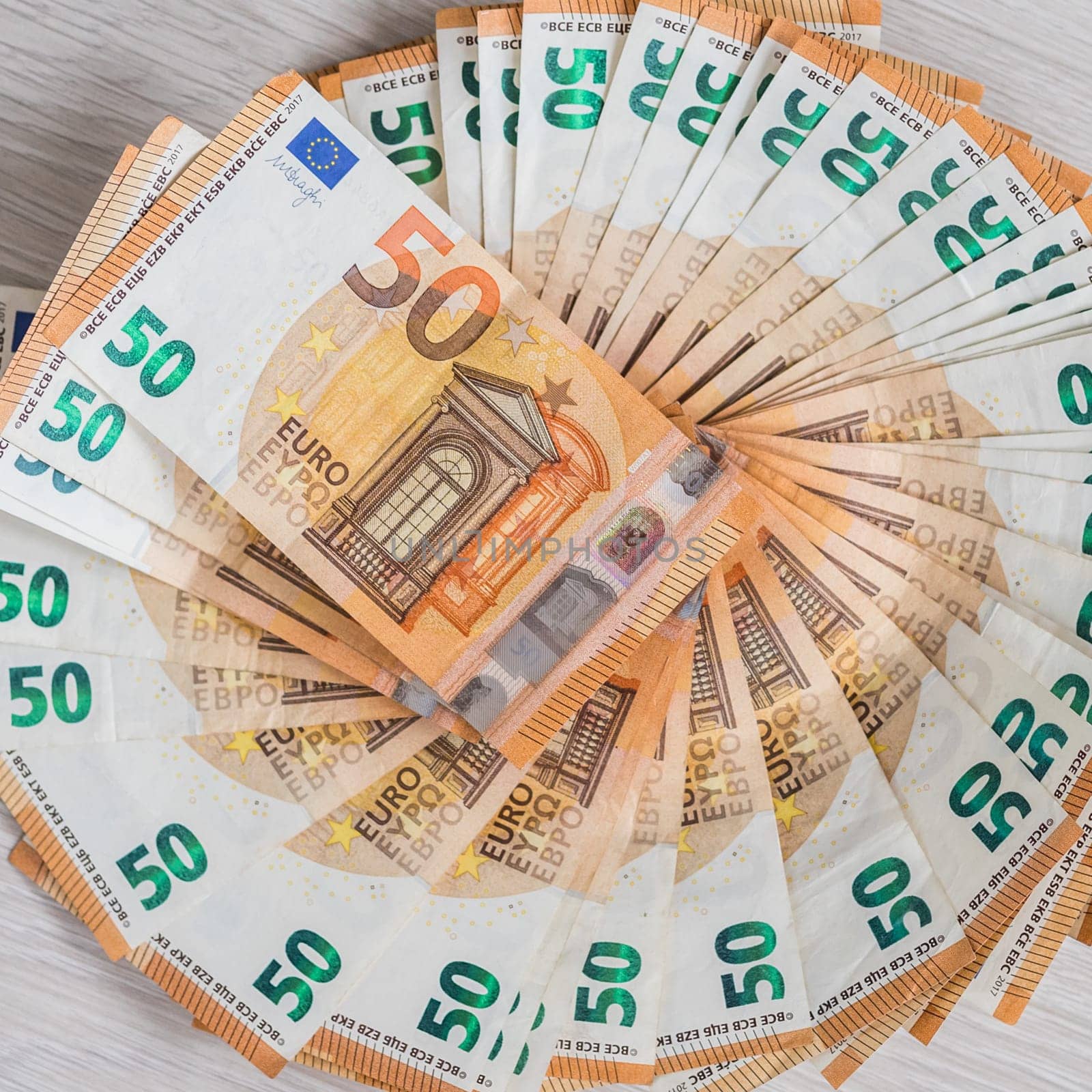 Pile of 50 euro notes, business background.