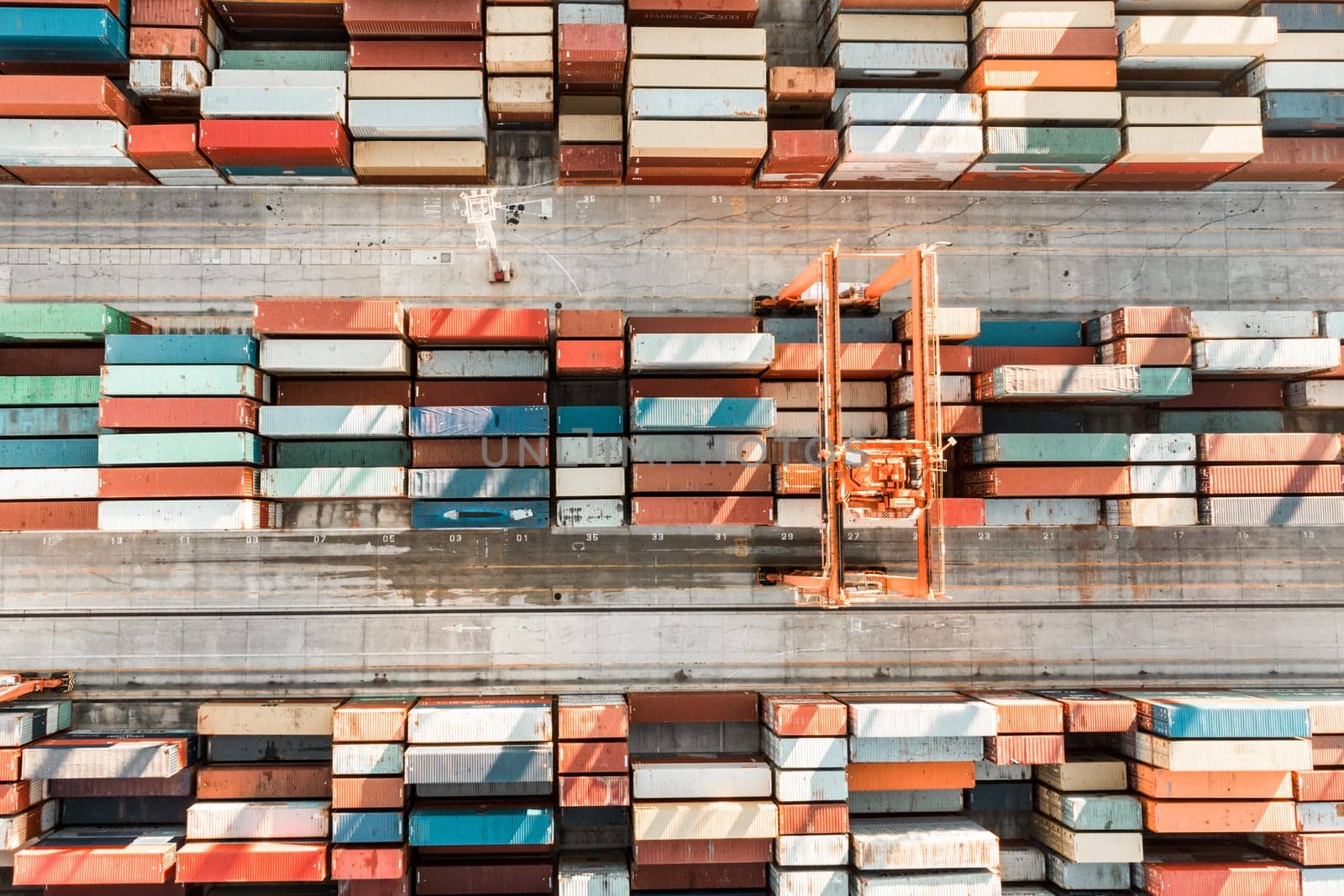 Aerial view of shipping container port terminal. Colourful pattern of containers in harbor. Maritime logistics global inport export trade transportation