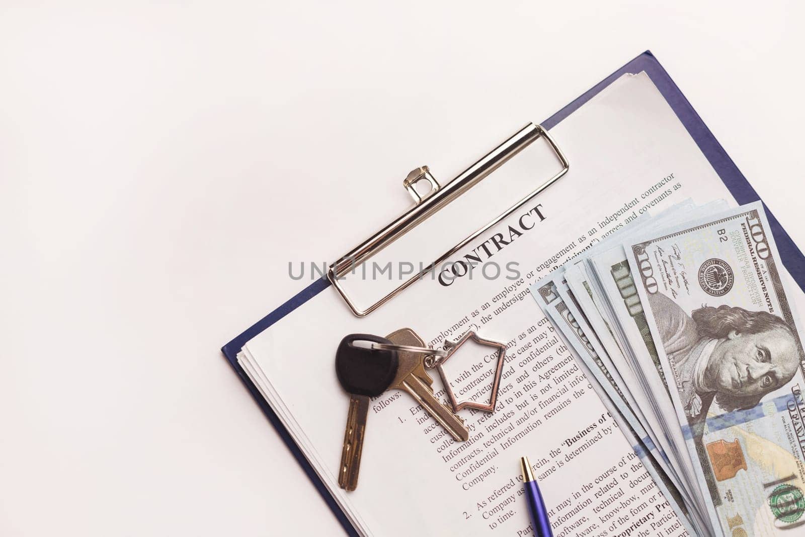 Real estate purchase contract with money and home keys on white table. Rental deal business trip living long term rental. Payment cash