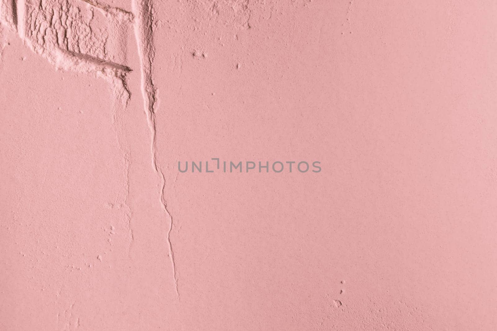 Cosmetic background, clay texture. Mask pink dry clay for face and body