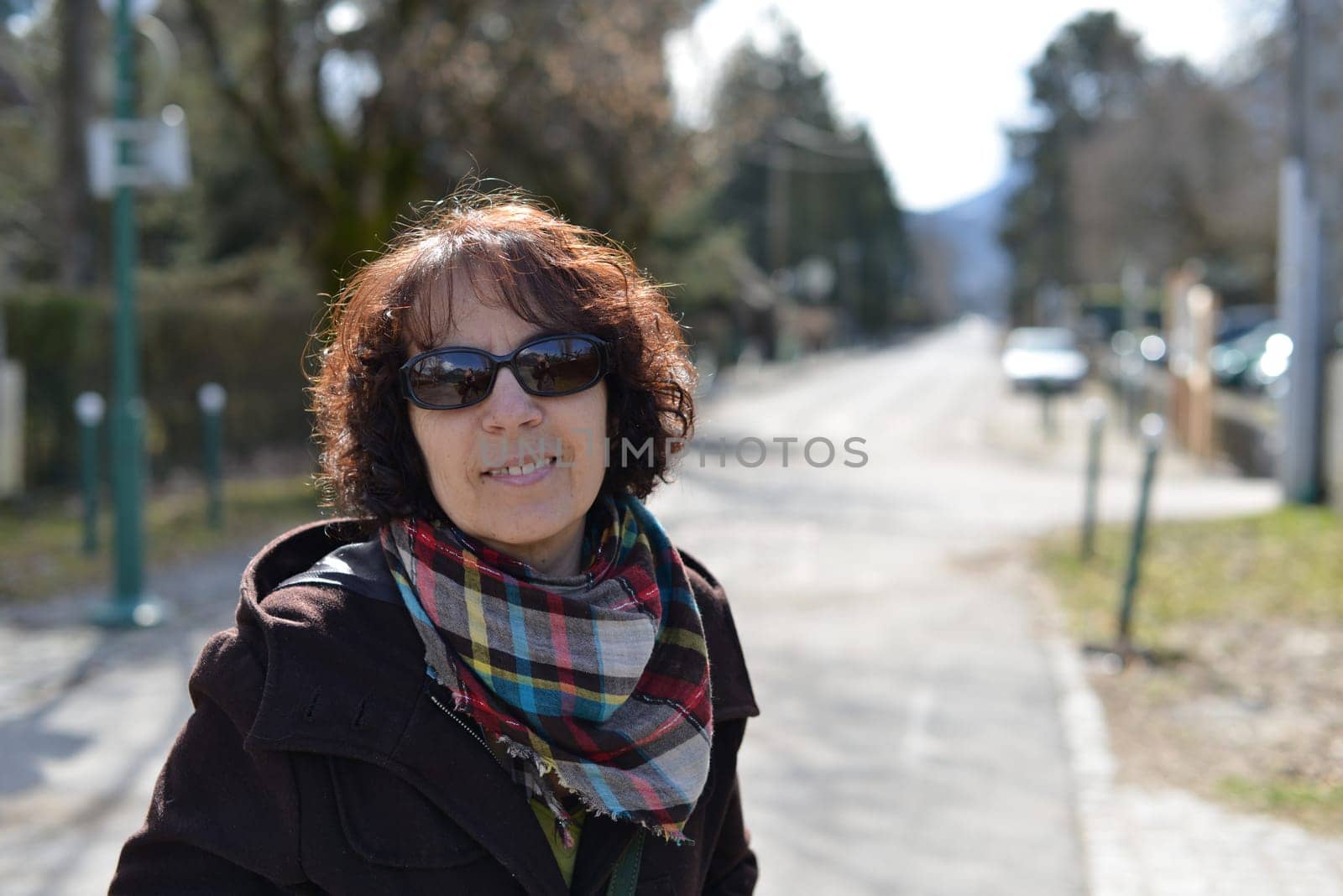 a portrait of beautiful mature brunette with sunglasses
