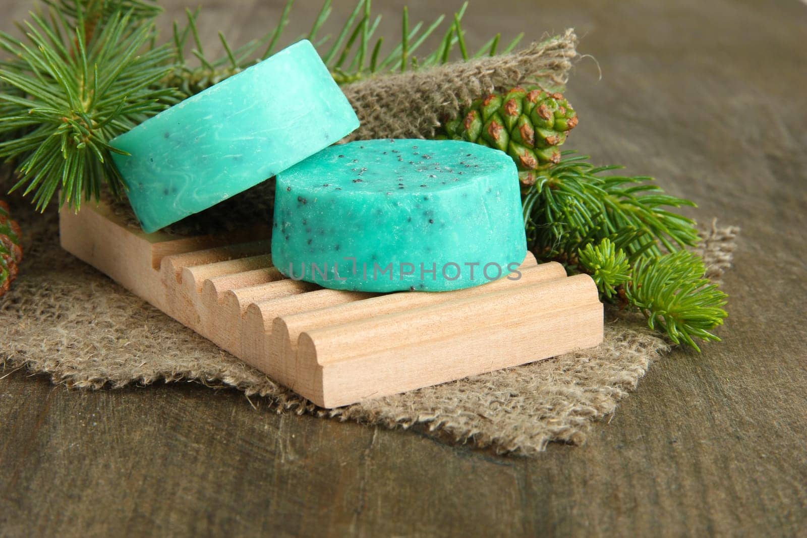 Hand-made soap and sea salt  on grey bamboo mat