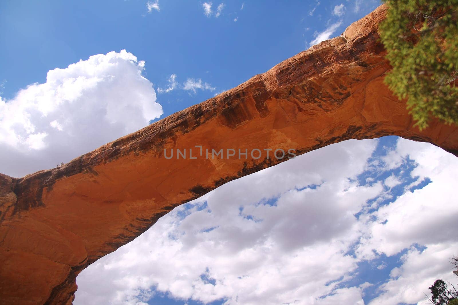 A close up of a red rock bridge in the Natural Bridges National Monument in Utah