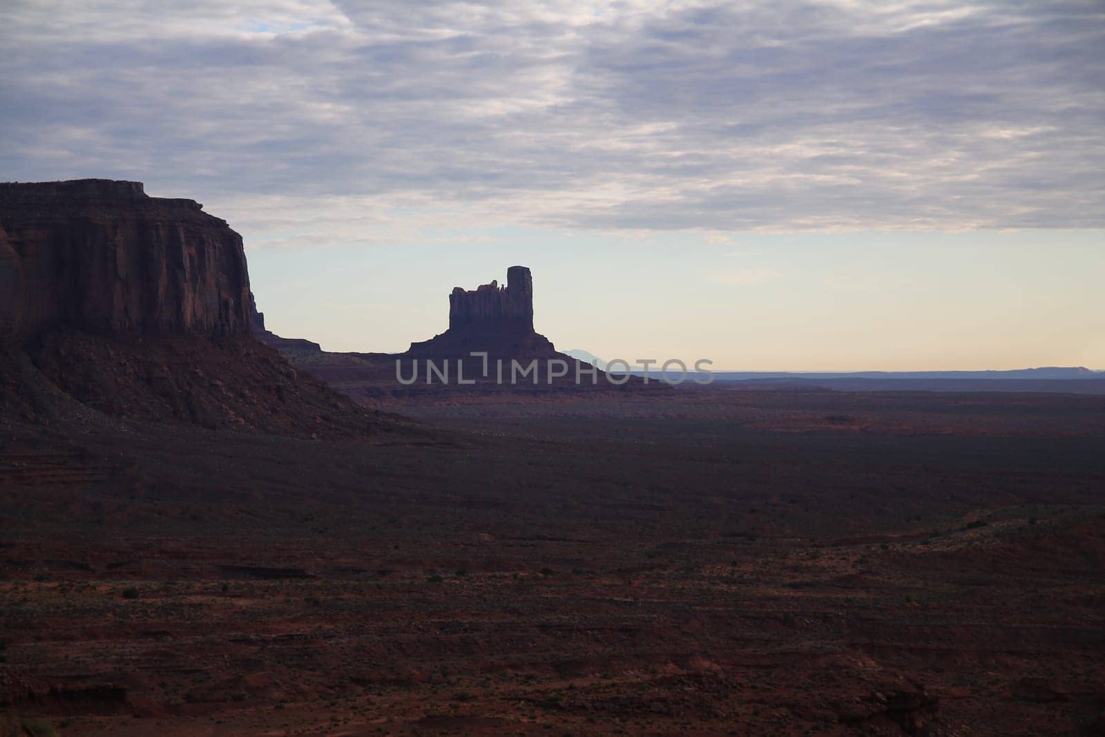 The dark colors of the Monument Valley during a sunset of a rainy day in Utah