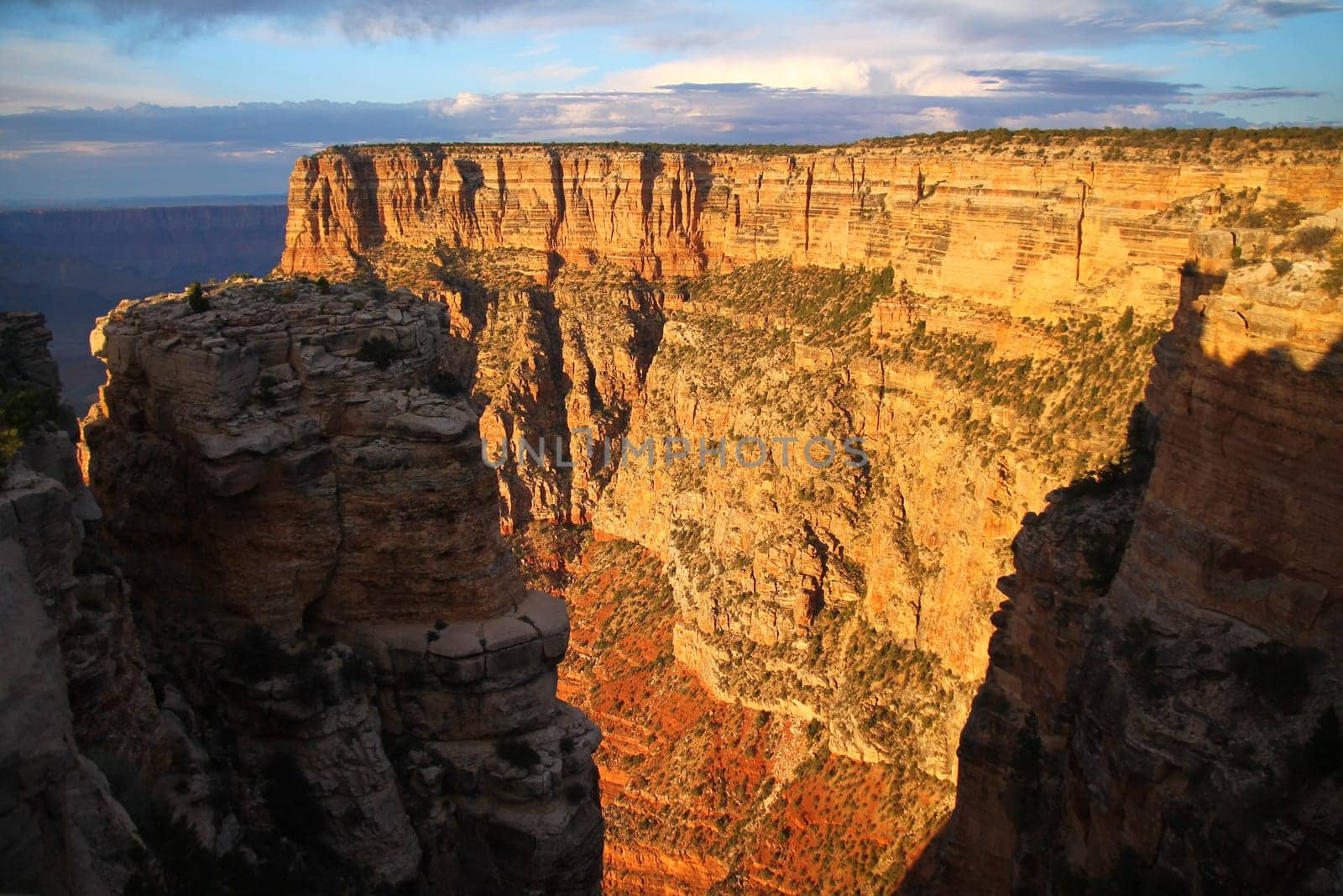 A stratification wall during a orange sunrise in the Grand Canyon National Park in Arizona