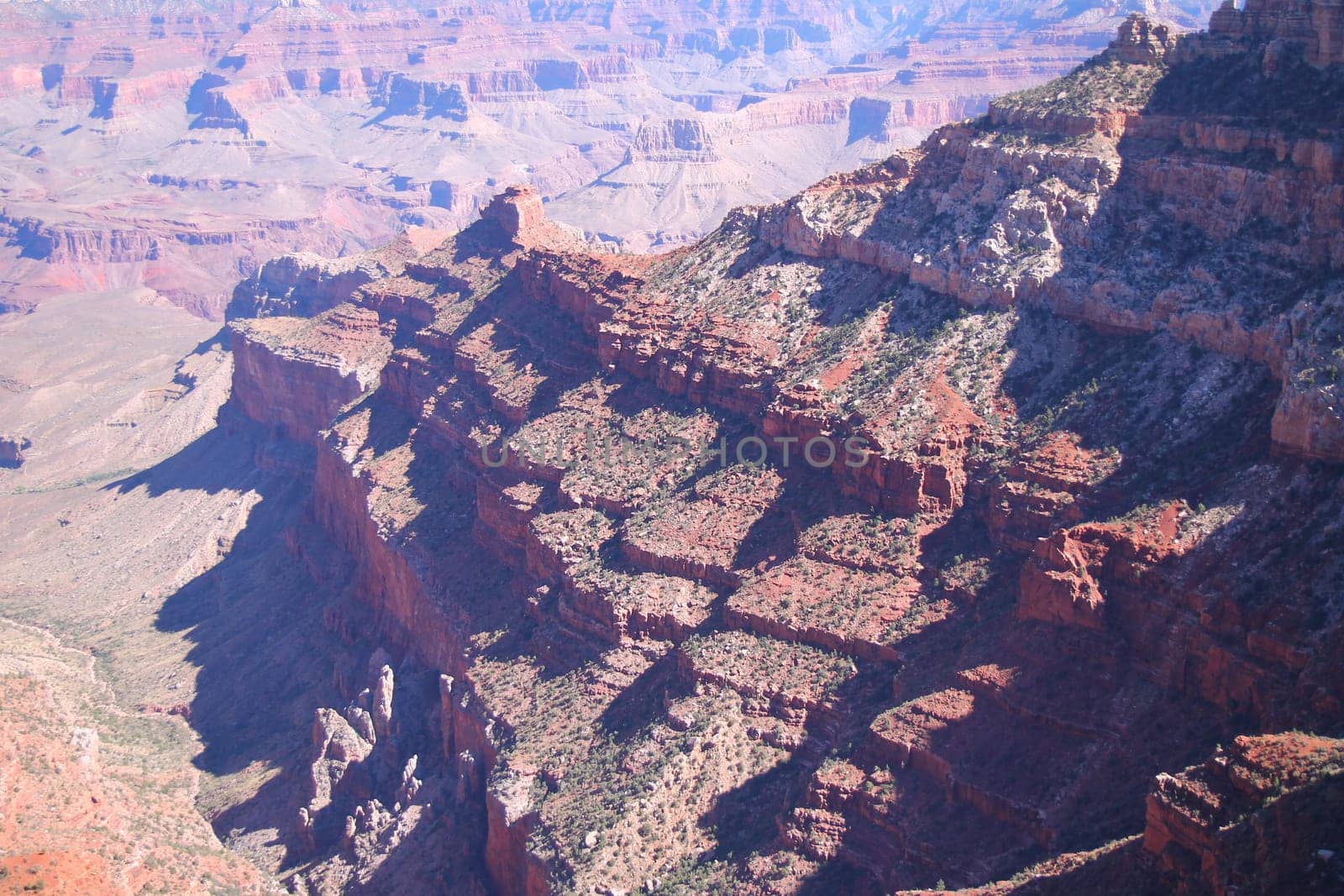 The various shades of red generated by the sun on the red rocks of the Grand Canyon National Park in Arizona