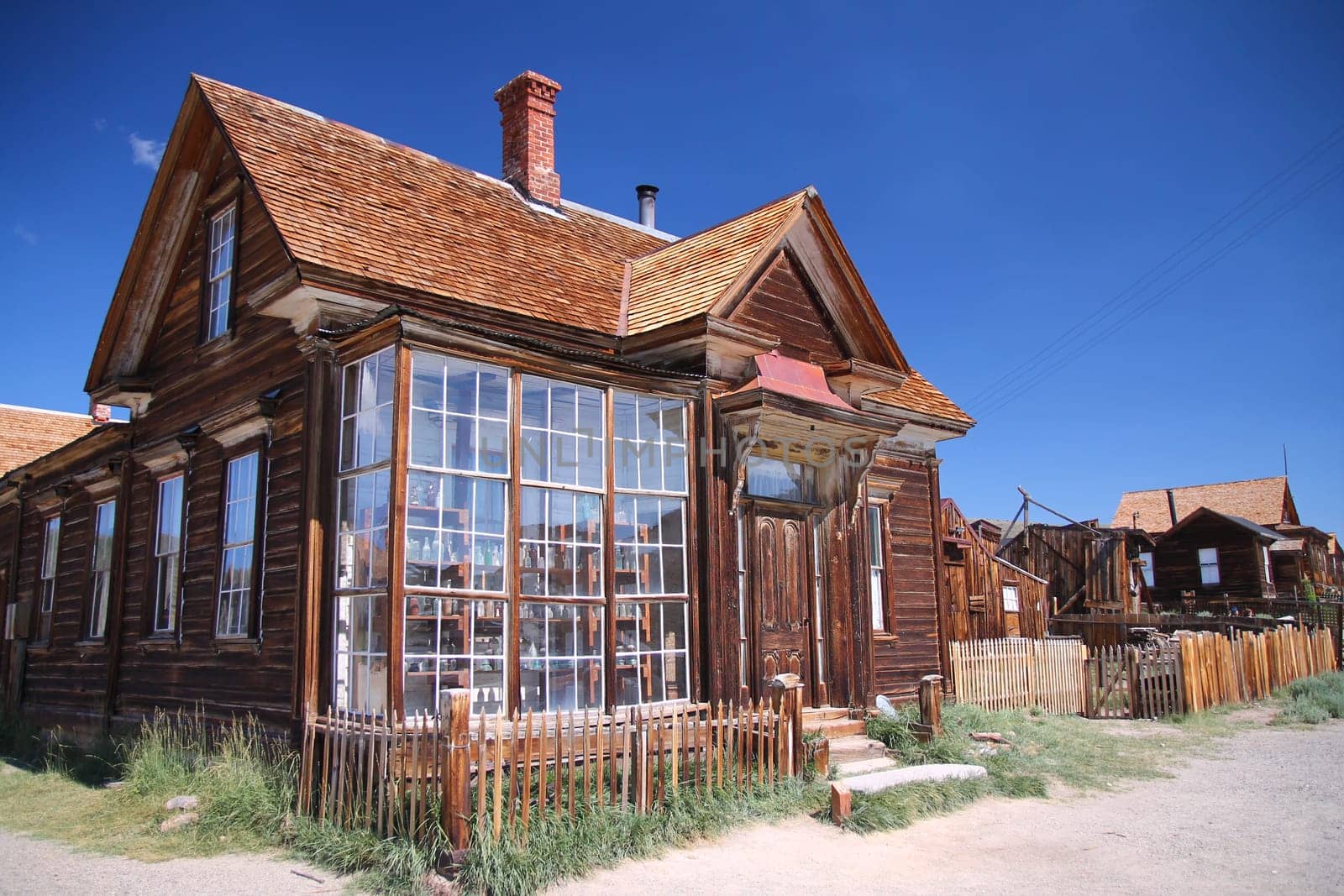 The windows of the abandoned pharmacy of the Bodie ghost town in the desert on California