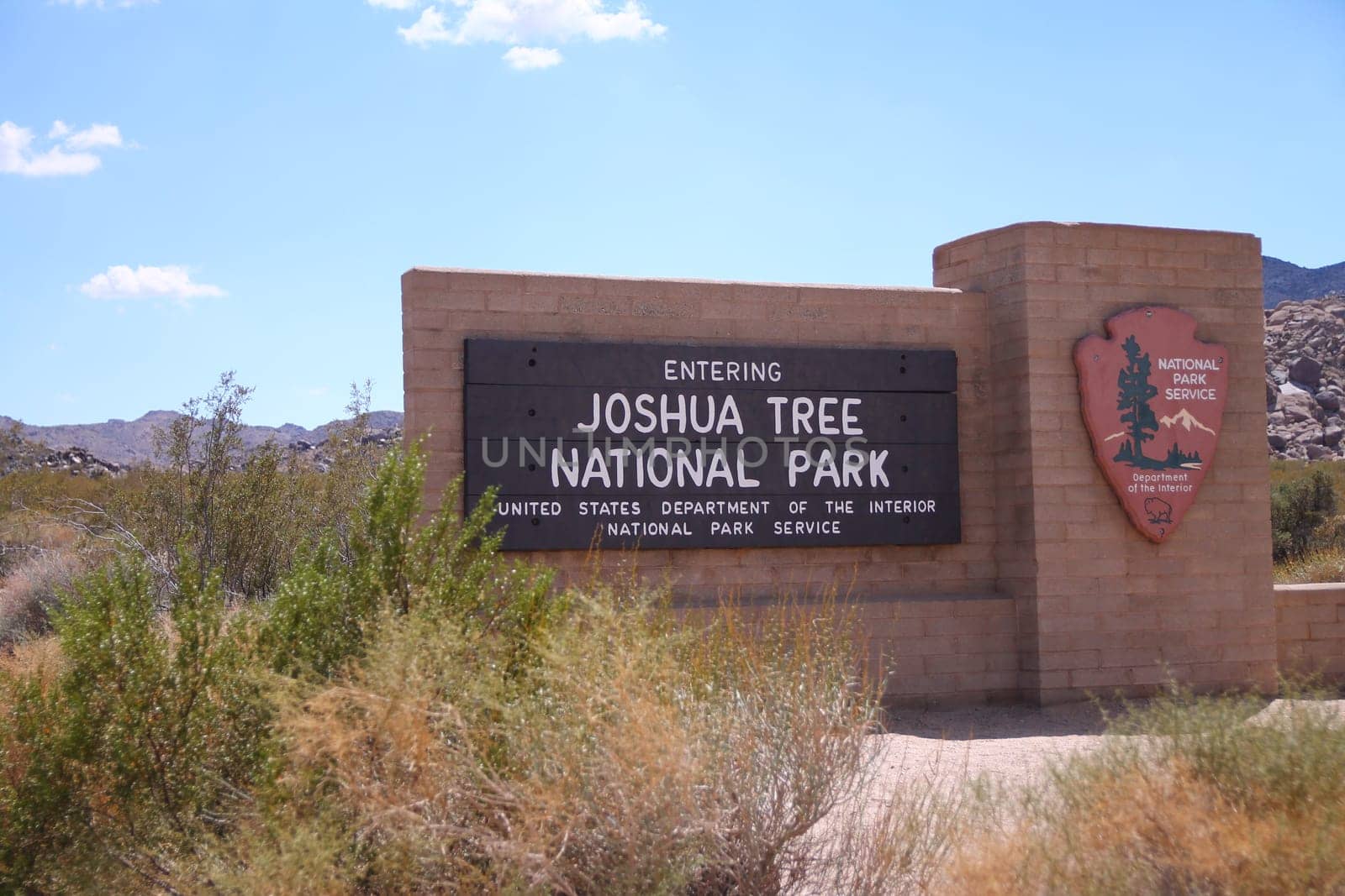 The traditional sign at the entrance of the Joshua Tree National Park in California