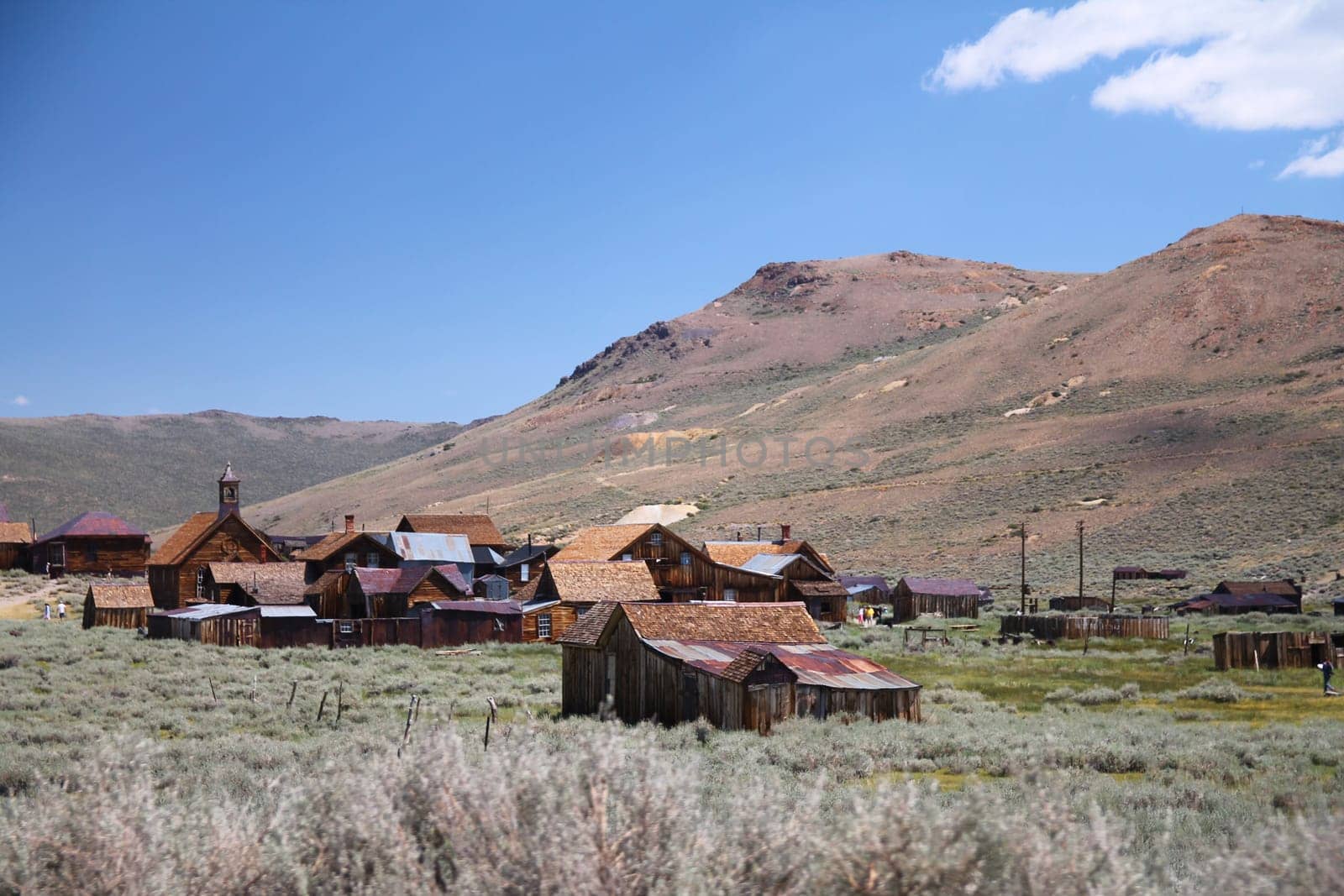 The beautiful ruins of the gold rush city of Bodie with the mountains and the desert of Nevada