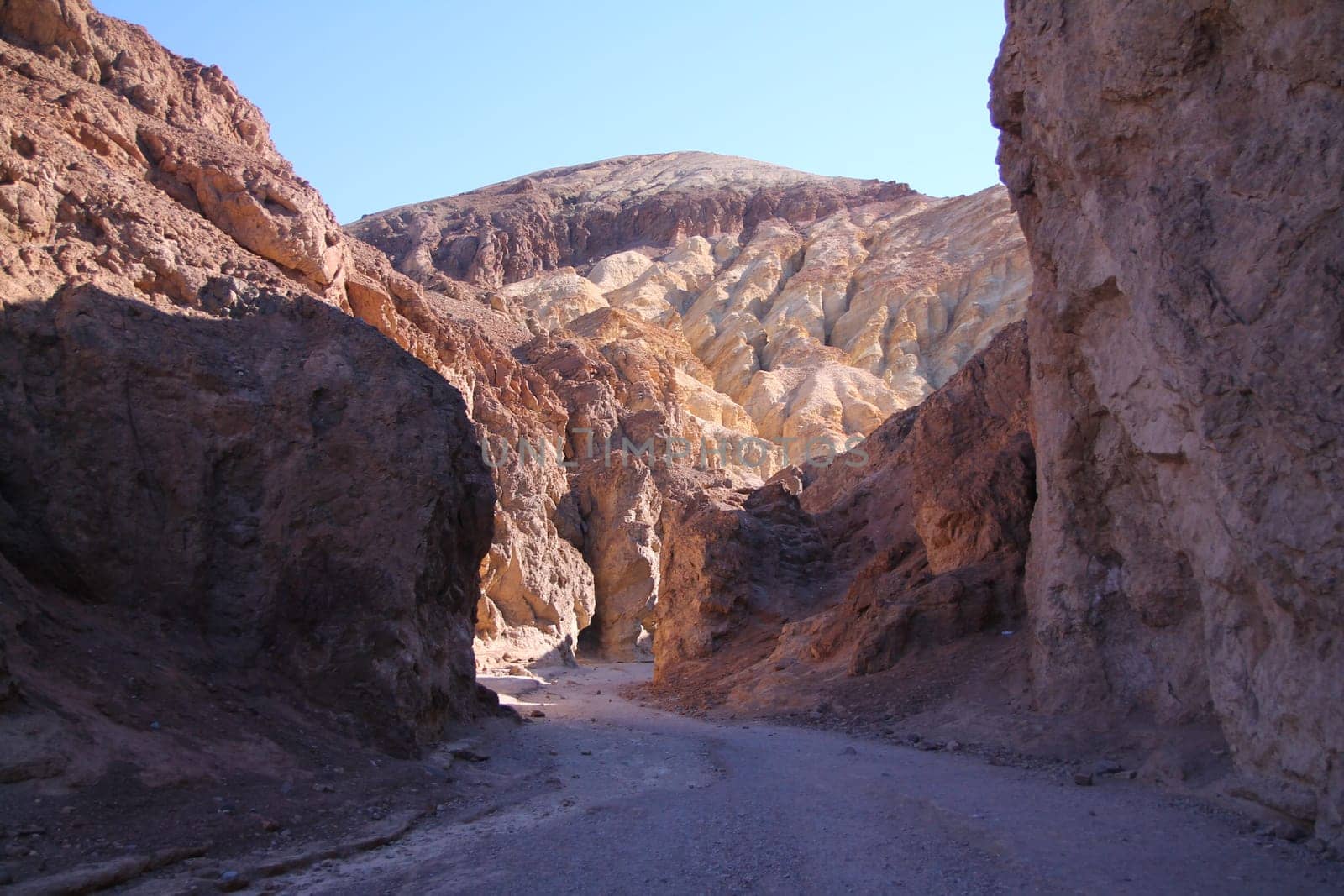 The shadows in the hot colored canyon in the Death Valley desert in California