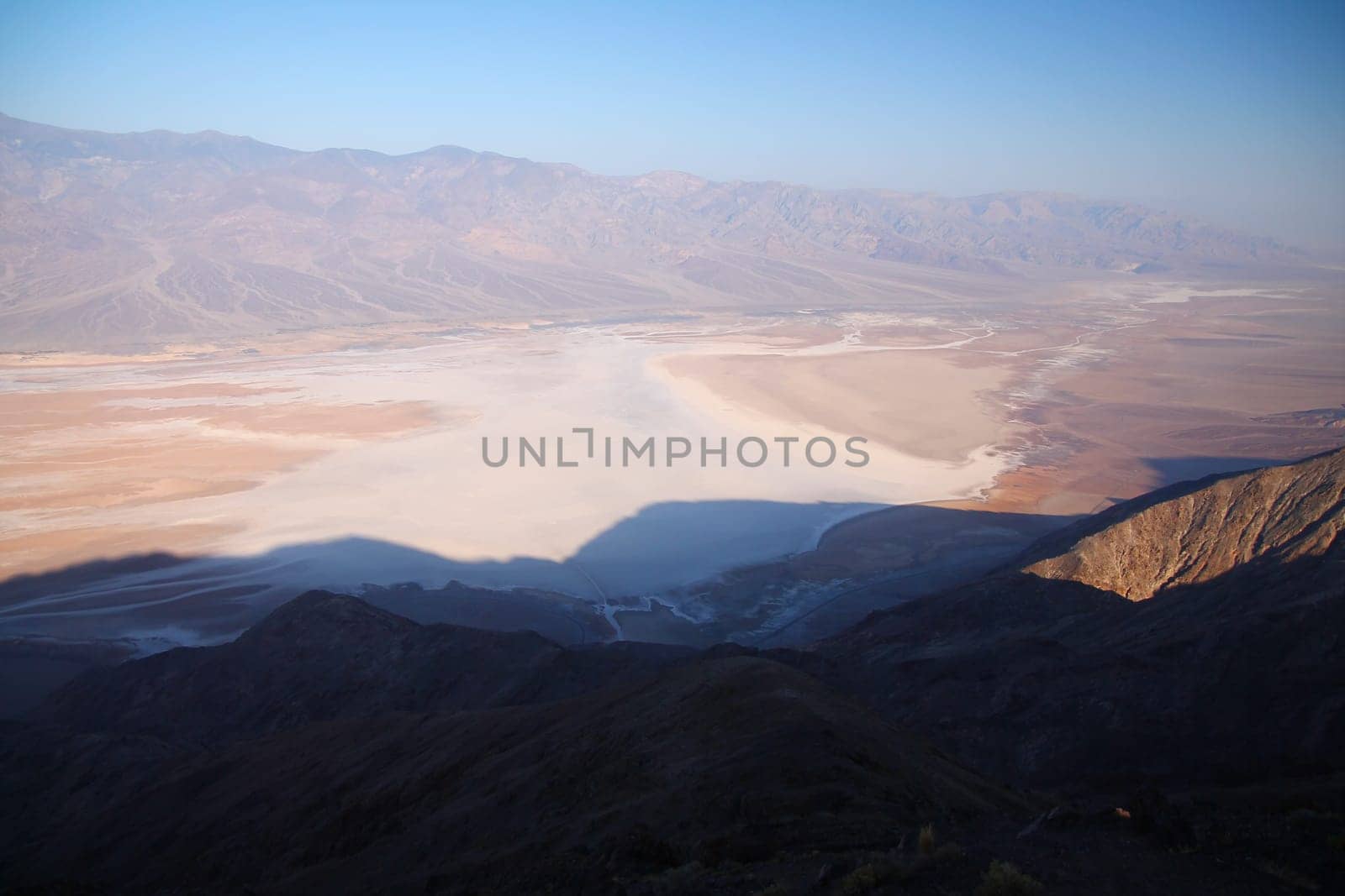 The white salt dried lake of Badwater Basin from the top of the mountain in the Death Valley desert