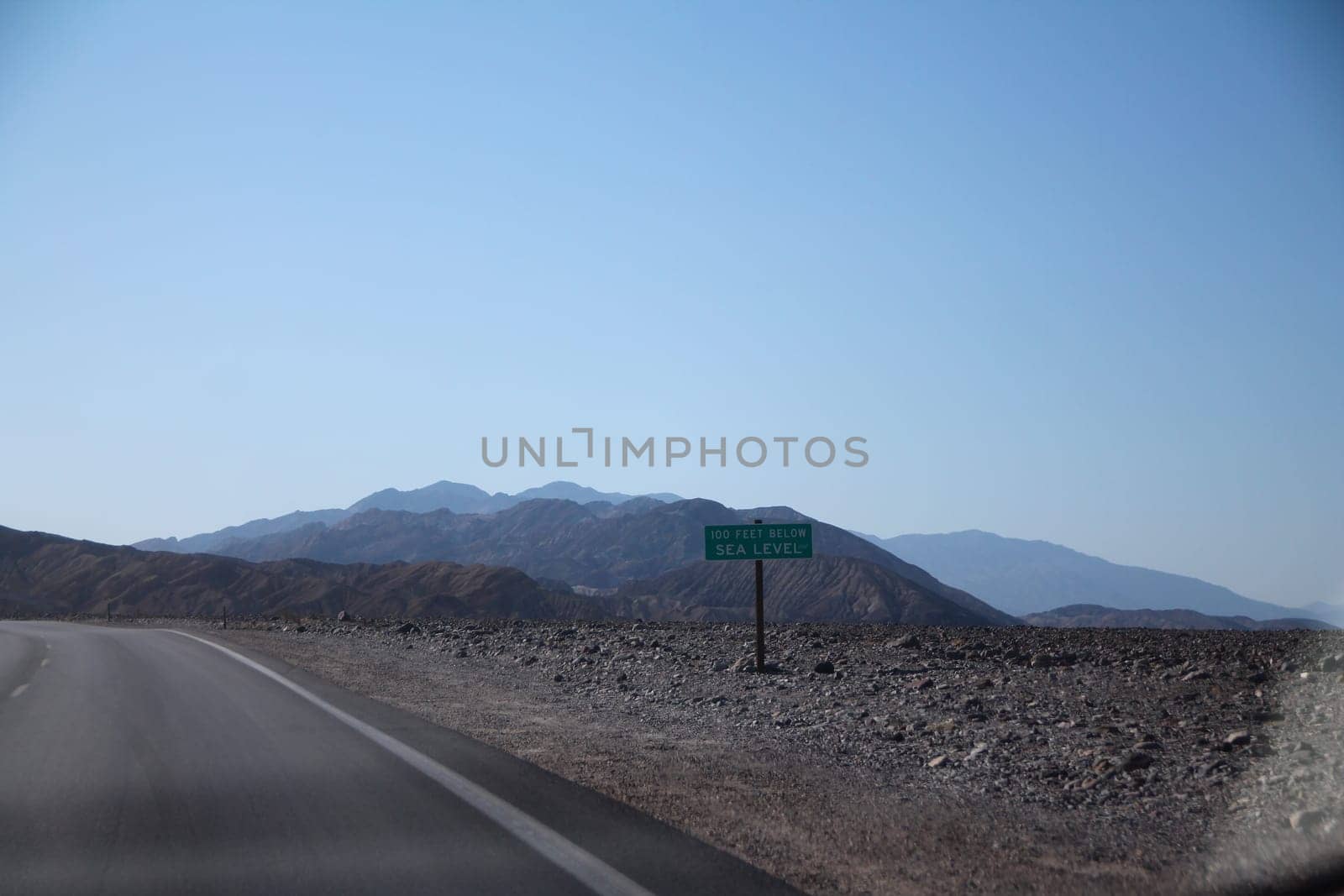 100 Feet below sea level sign in the middle of the Death Valley desert in California