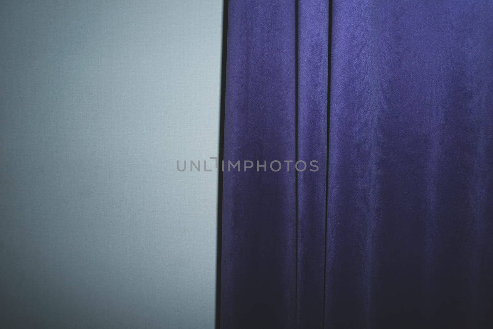 Curtain on the wall. violet drapery
