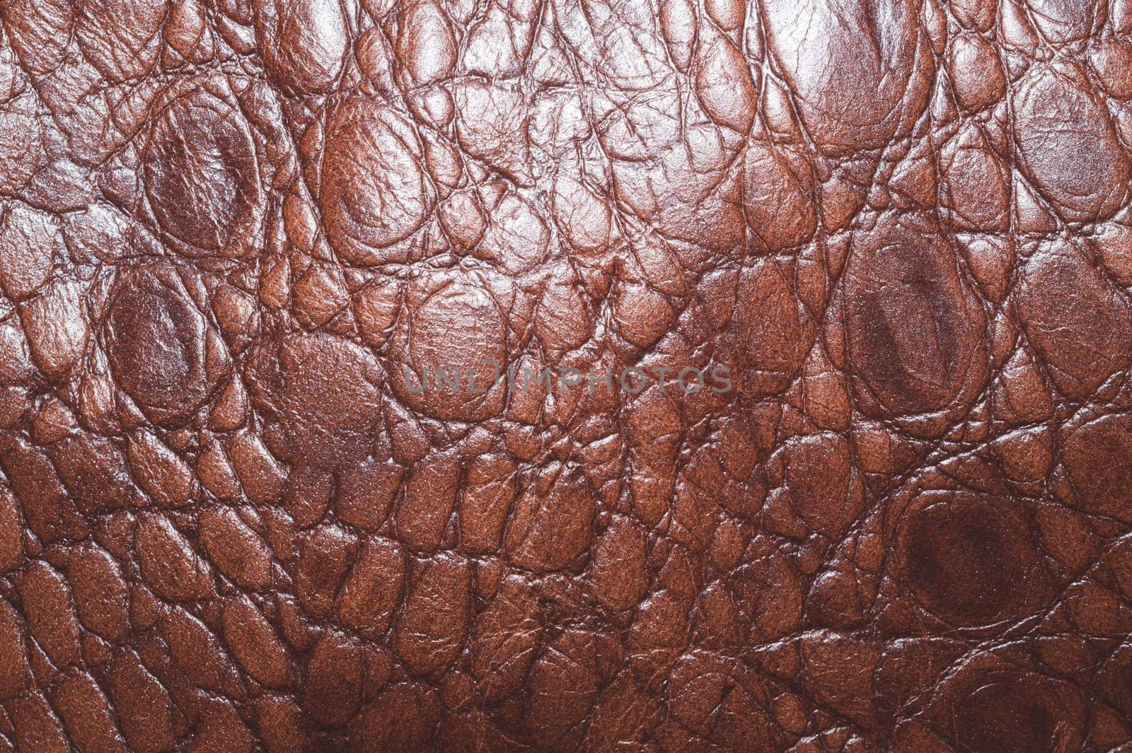 Brown leather texture close up background. rough material