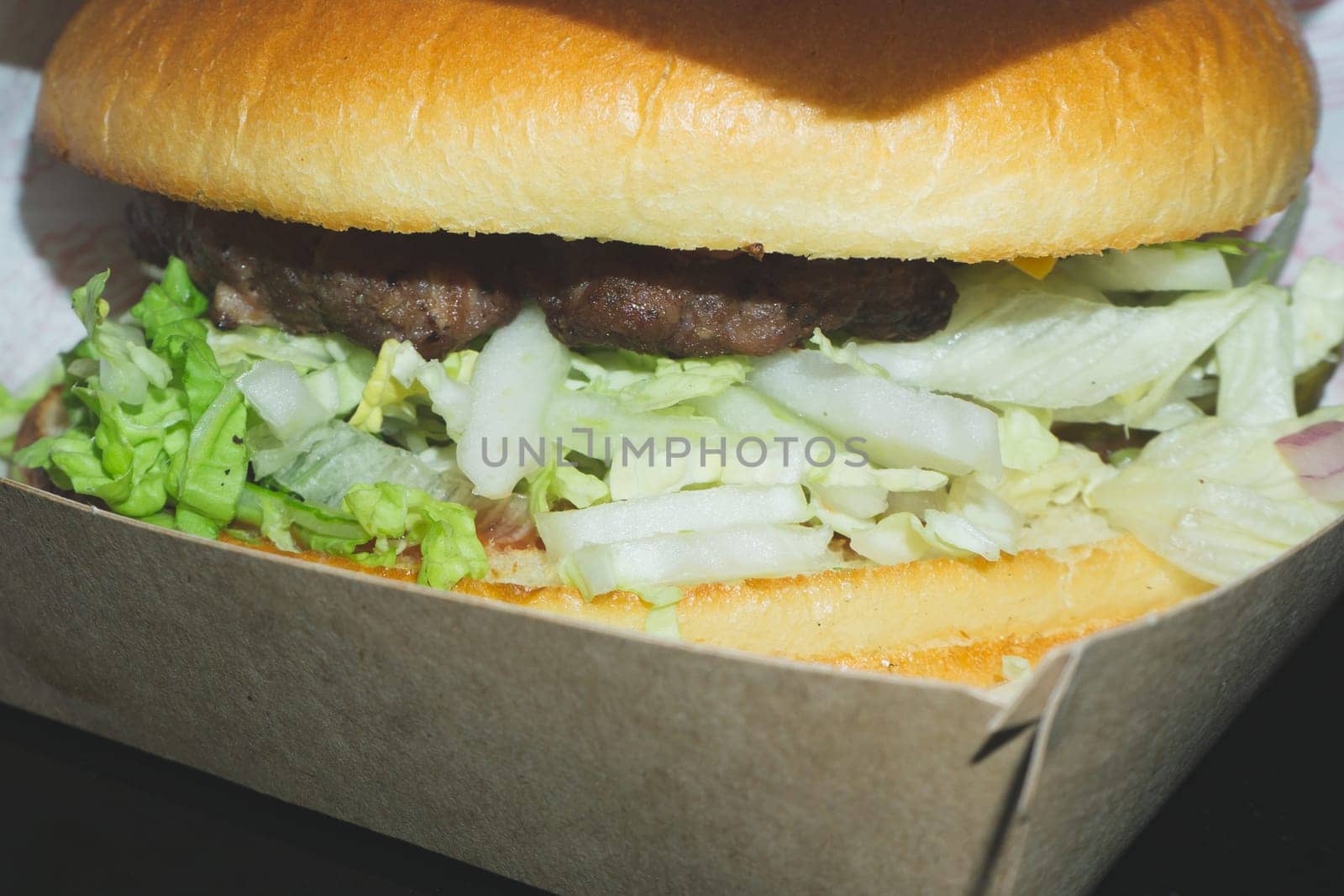 Burger in cardboard box close up