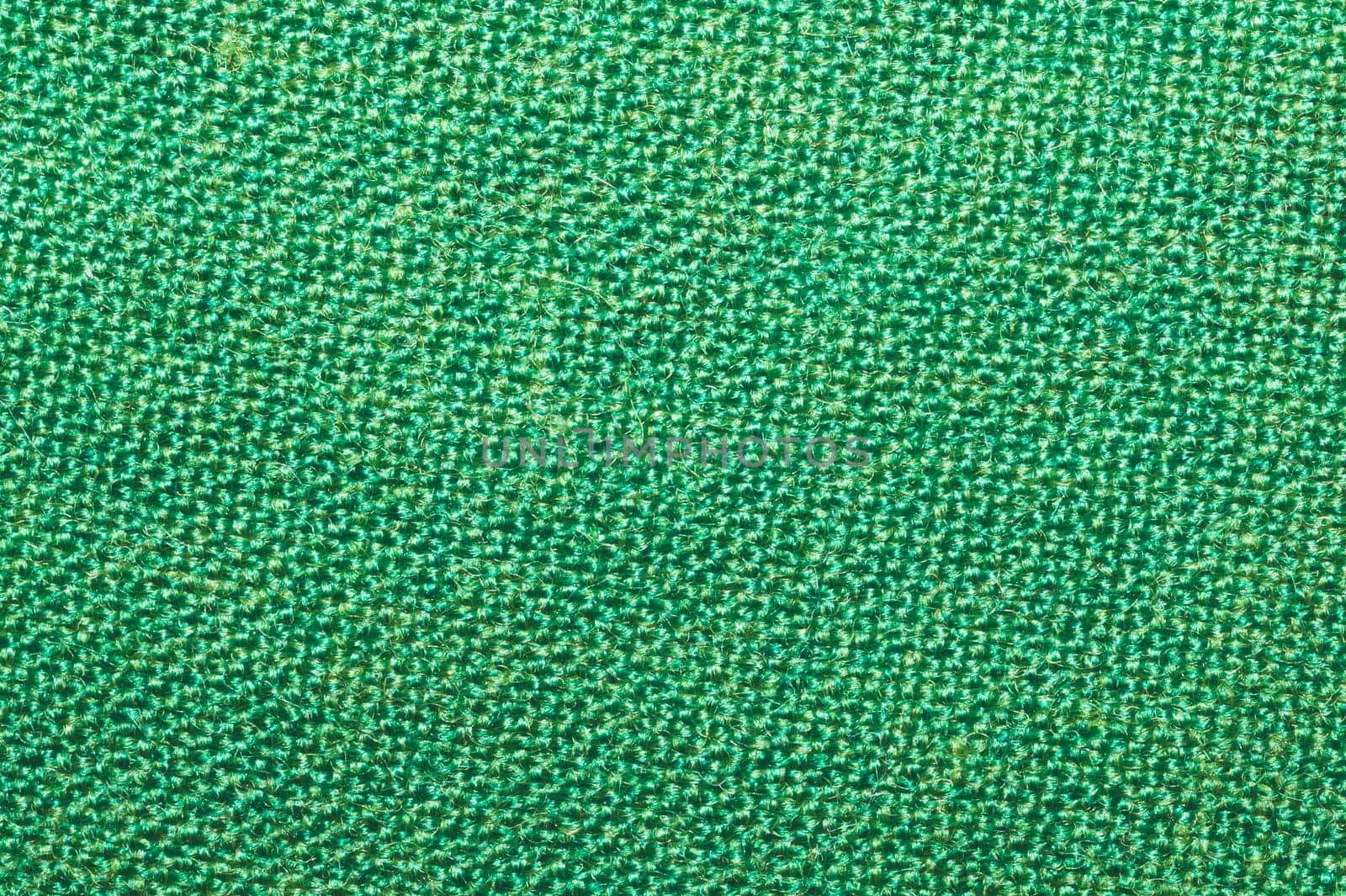 Green fabric close up. textile background. cloth backdrop