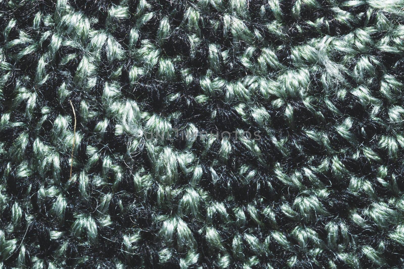 Knitted background. woolen fabric close up