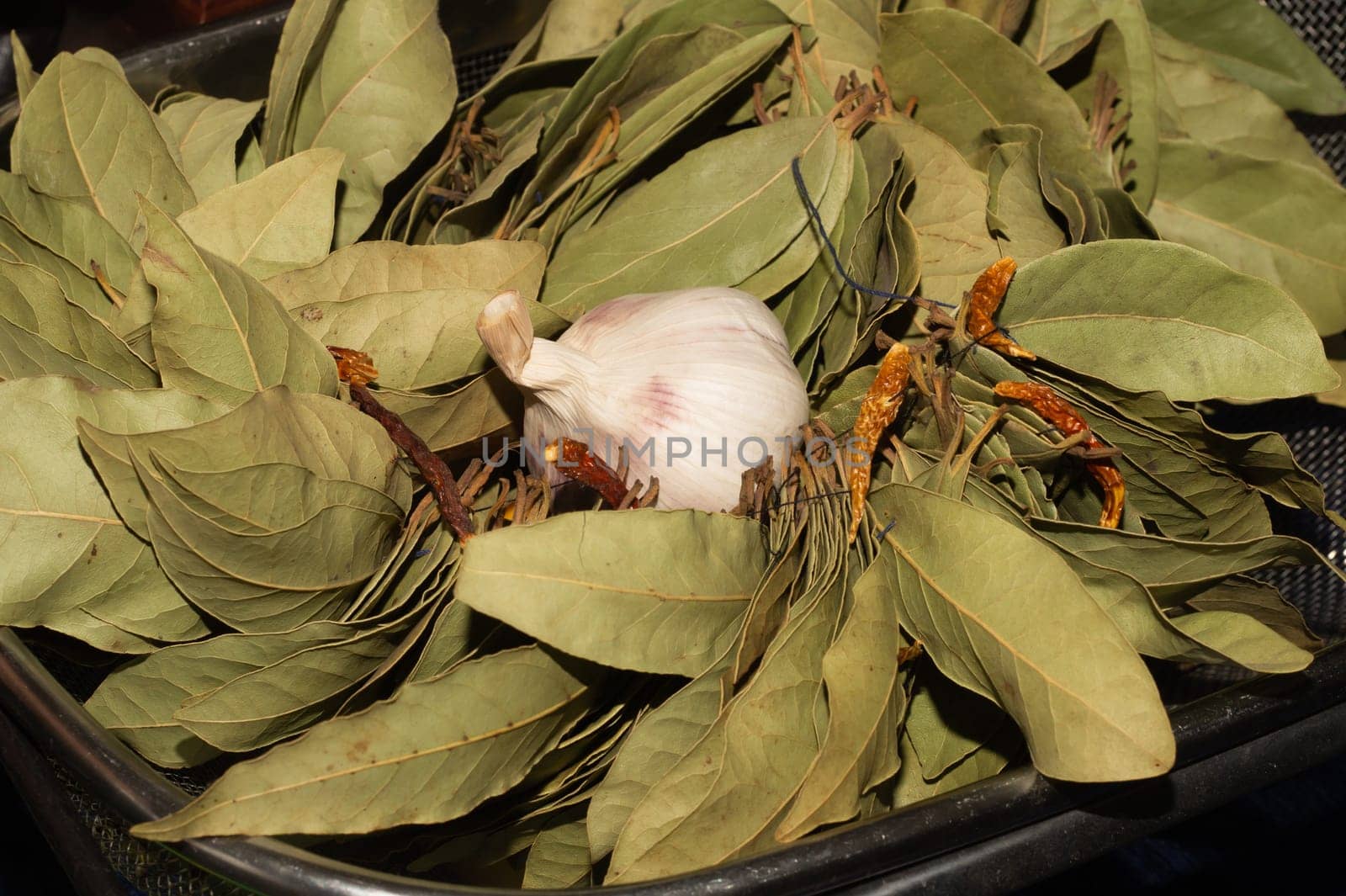Garlic and bay leaves. dried hot peppers close up