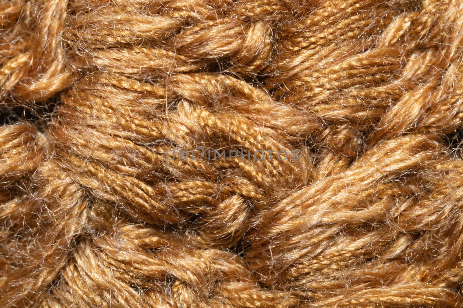 Knitted woolen background close up. brown soft fabric