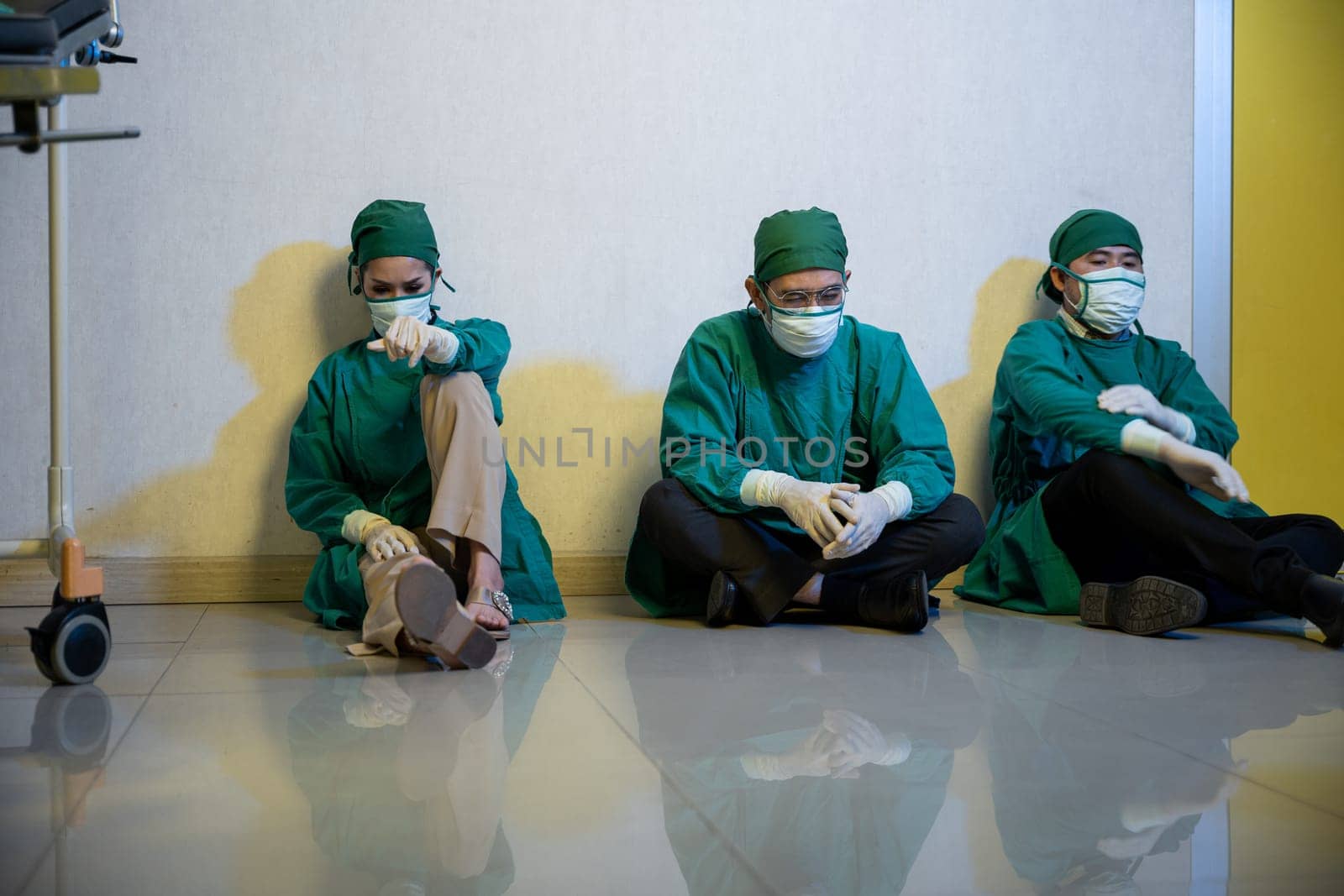 Tired doctor, Group of surgery doctors sadness fatigue after surgery, emotional sitting stress of overworked doctor and medical care team during covid-10, Surgical team tired after operation