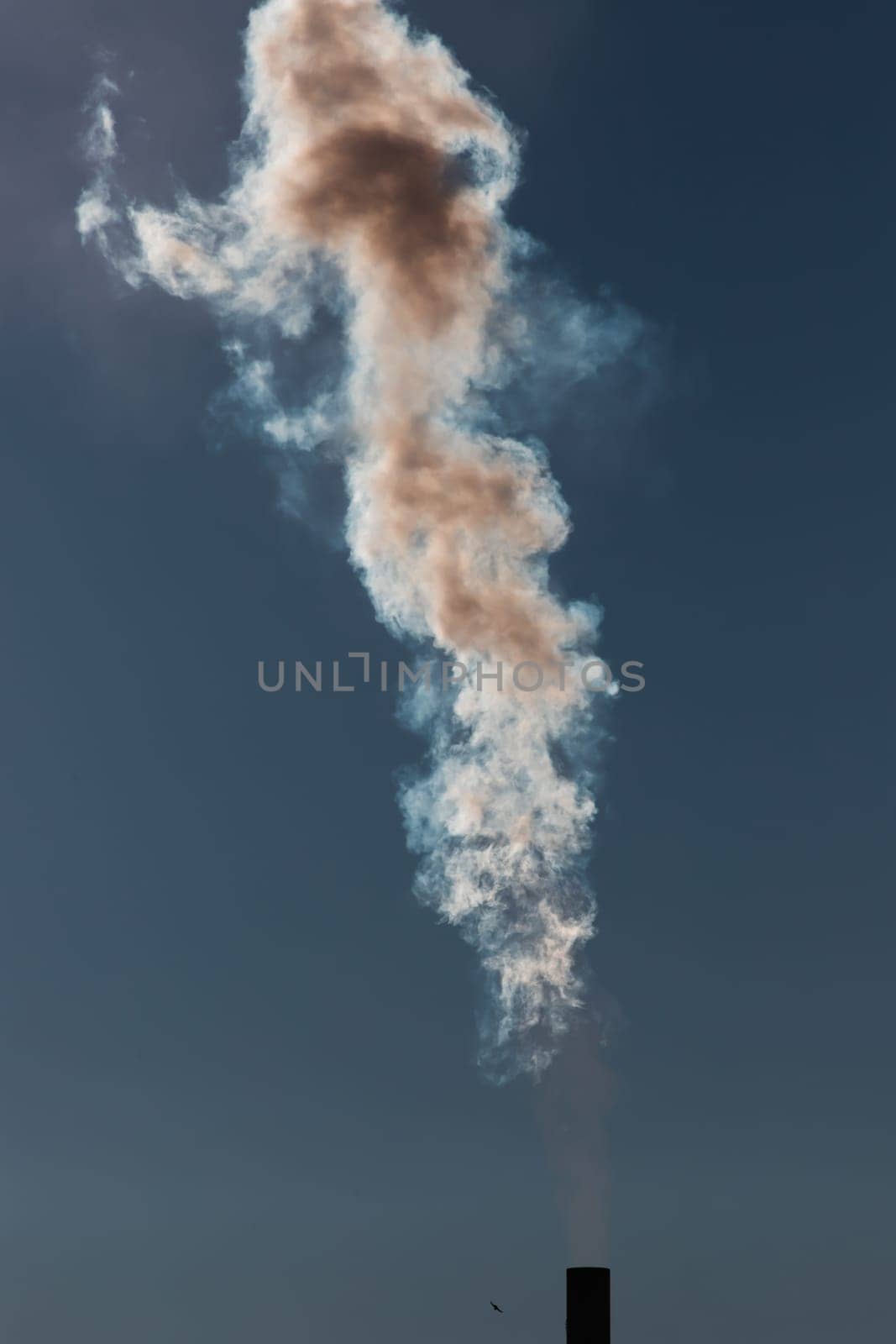 Air pollution from power plant chimneys. Industry and global warming concept