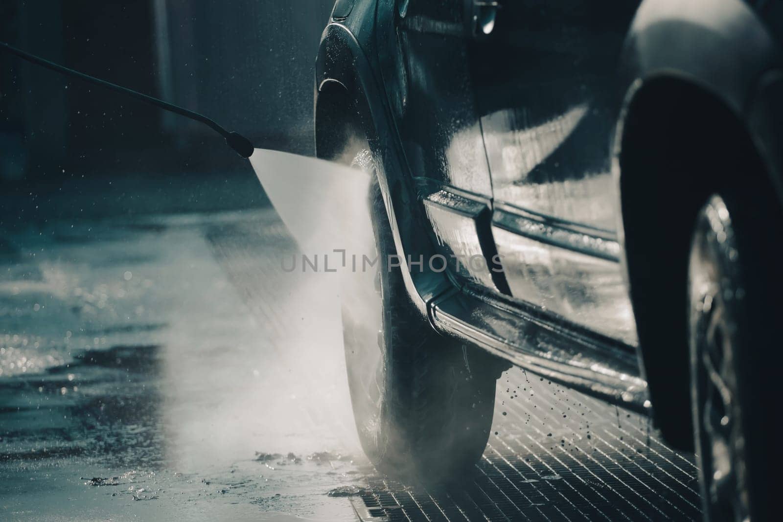 Car wash with pressurized water in car wash outside.