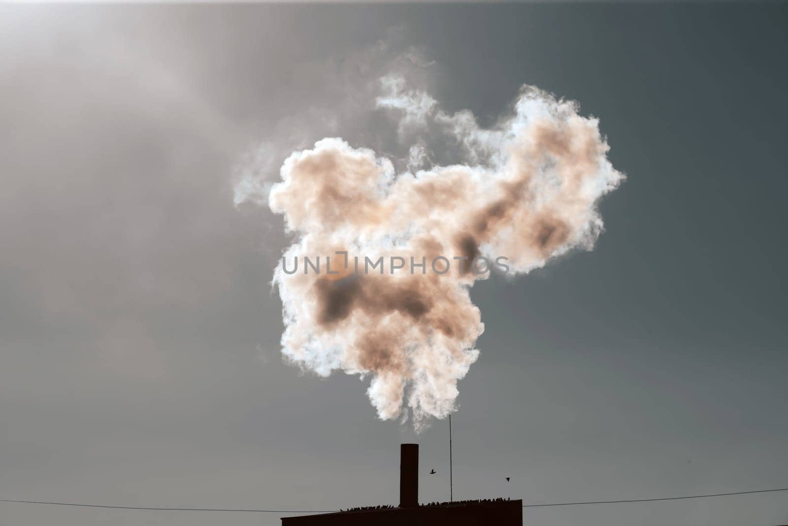 Air pollution from power plant chimneys. Industry and global warming concept