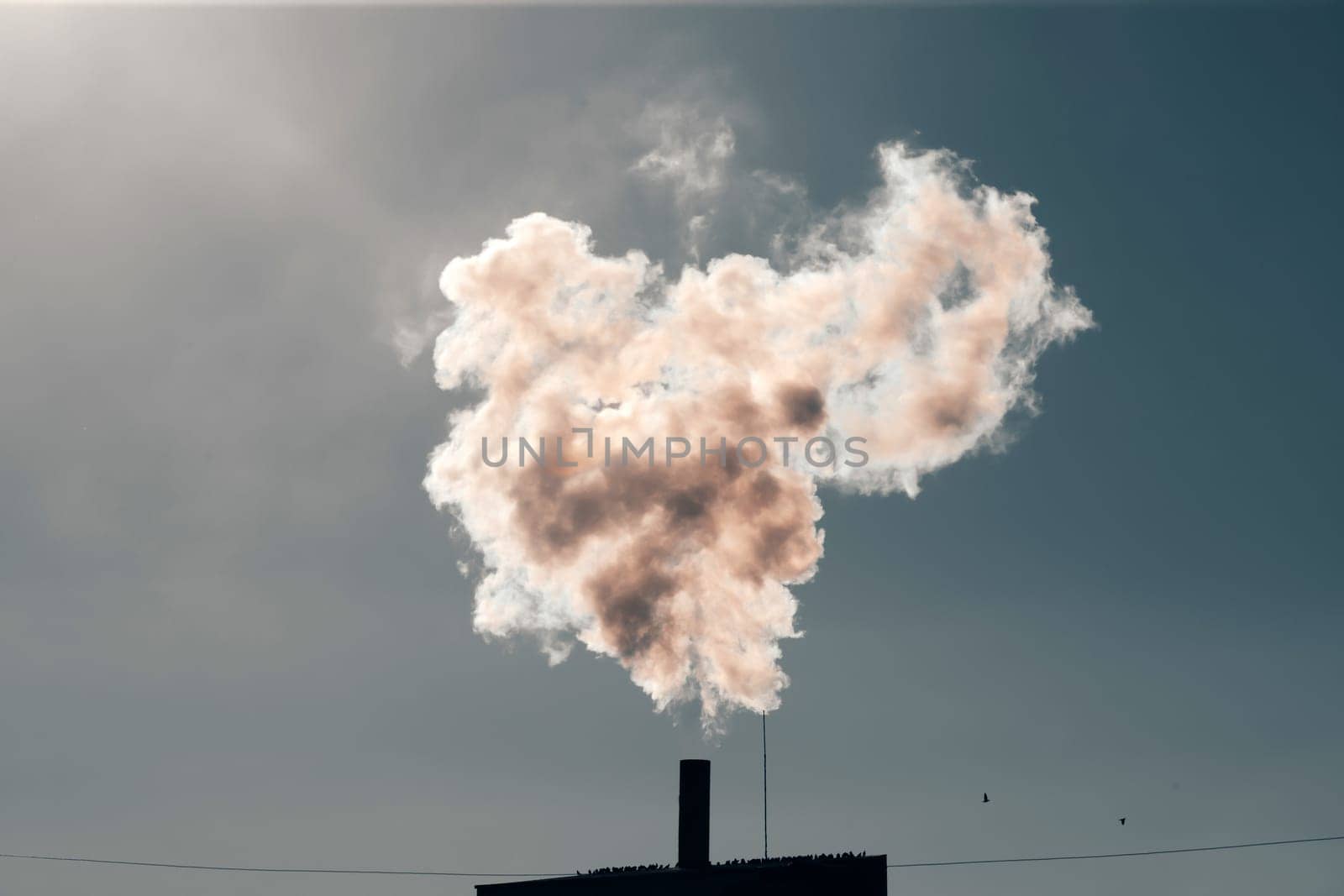 Air pollution from power plant chimneys. Industry and global warming concept