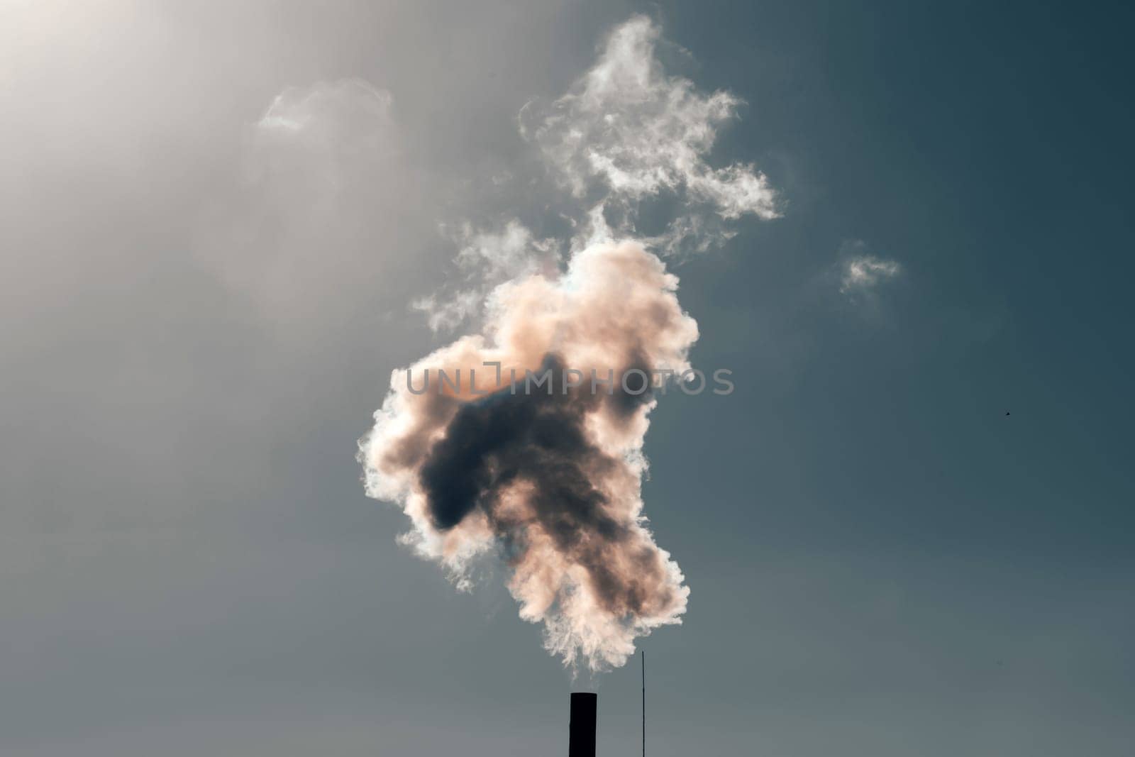 Air pollution from power plant chimneys. Industry and global warming concept