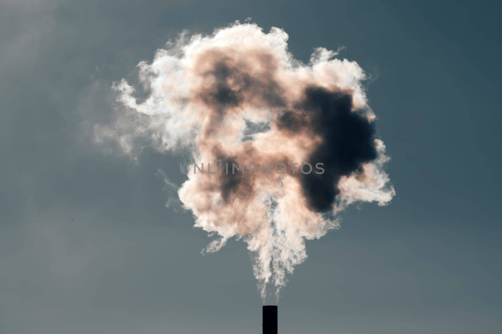 Air pollution from power plant chimneys. Industry and global warming concept