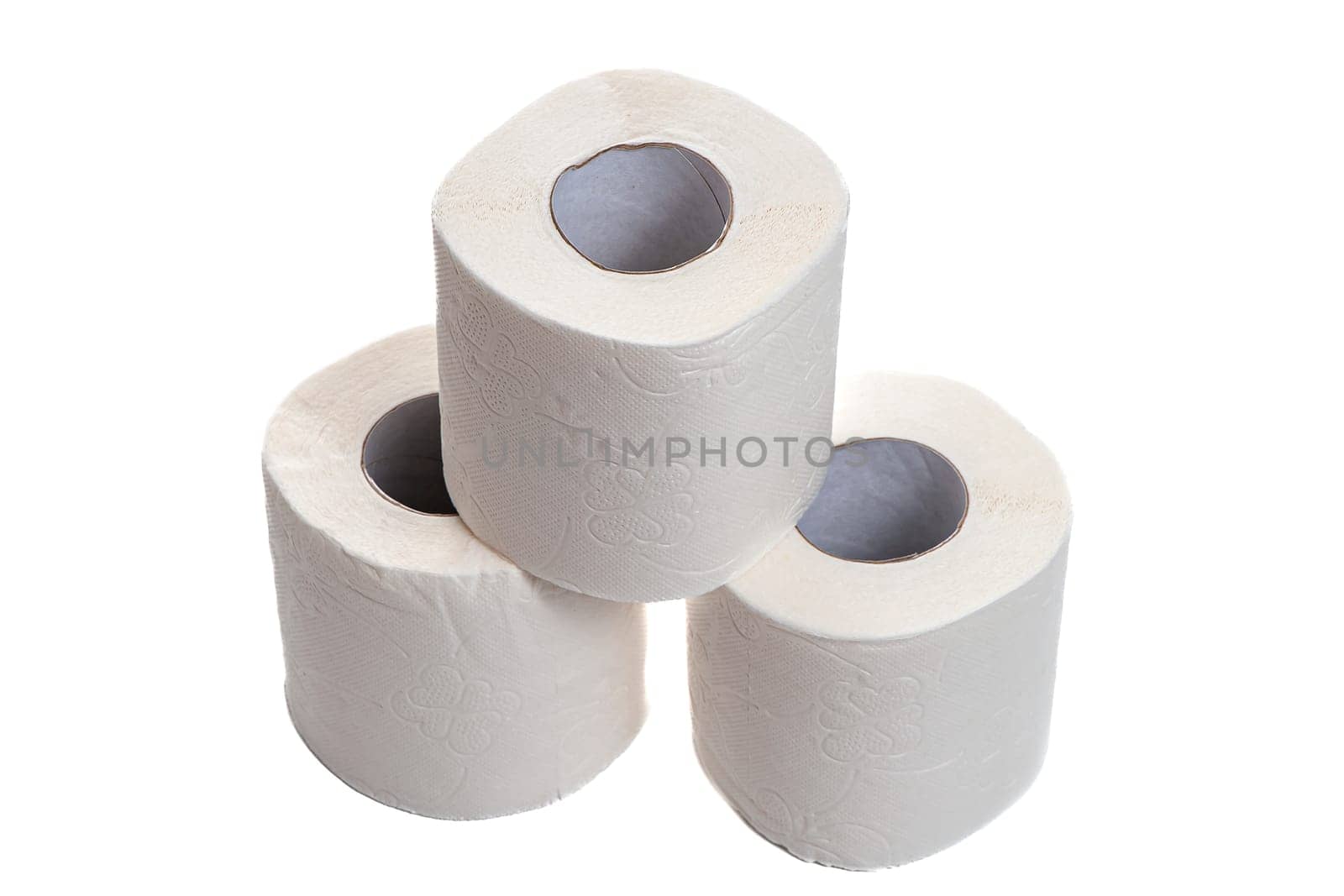 Three rolls of toilet paper stand in a pyramid on a white isolated background. High quality photo