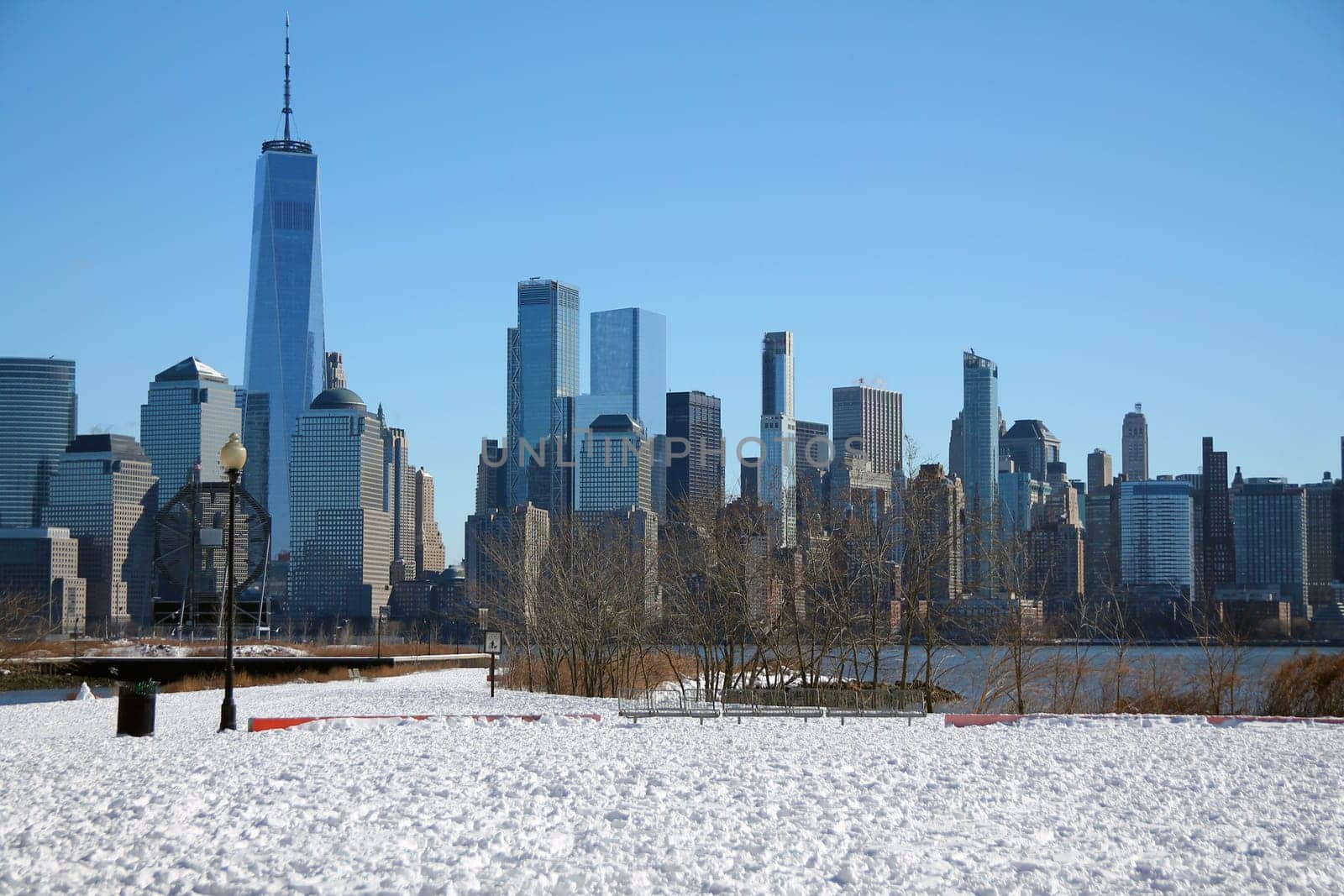 Downtown Manhattan with winter snow on the ground captured from Liberty State Park in Jersey City