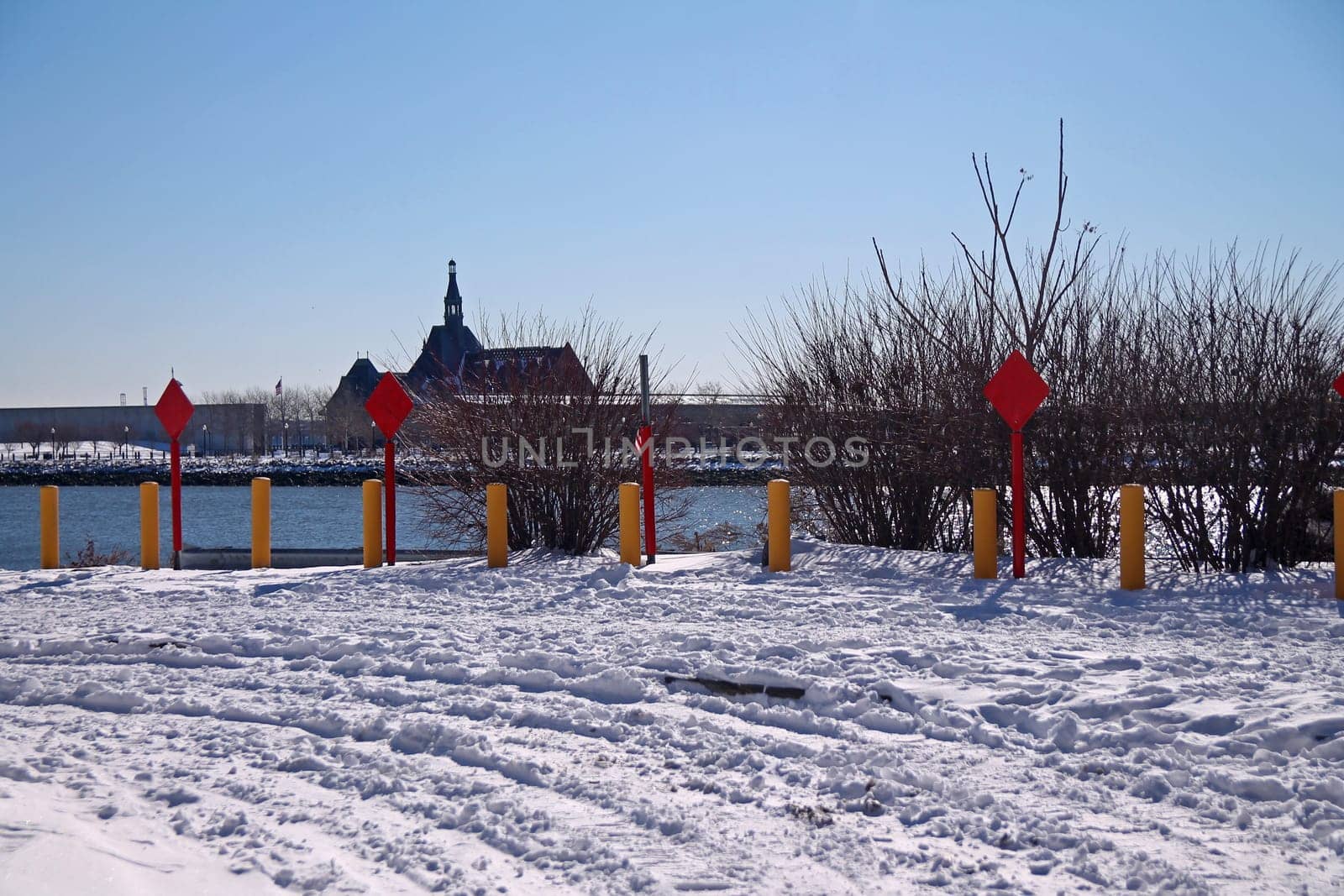 End of the road red signs with snow on the ground and Central Railroad of New Jersey Terminal on the back in Jersey City