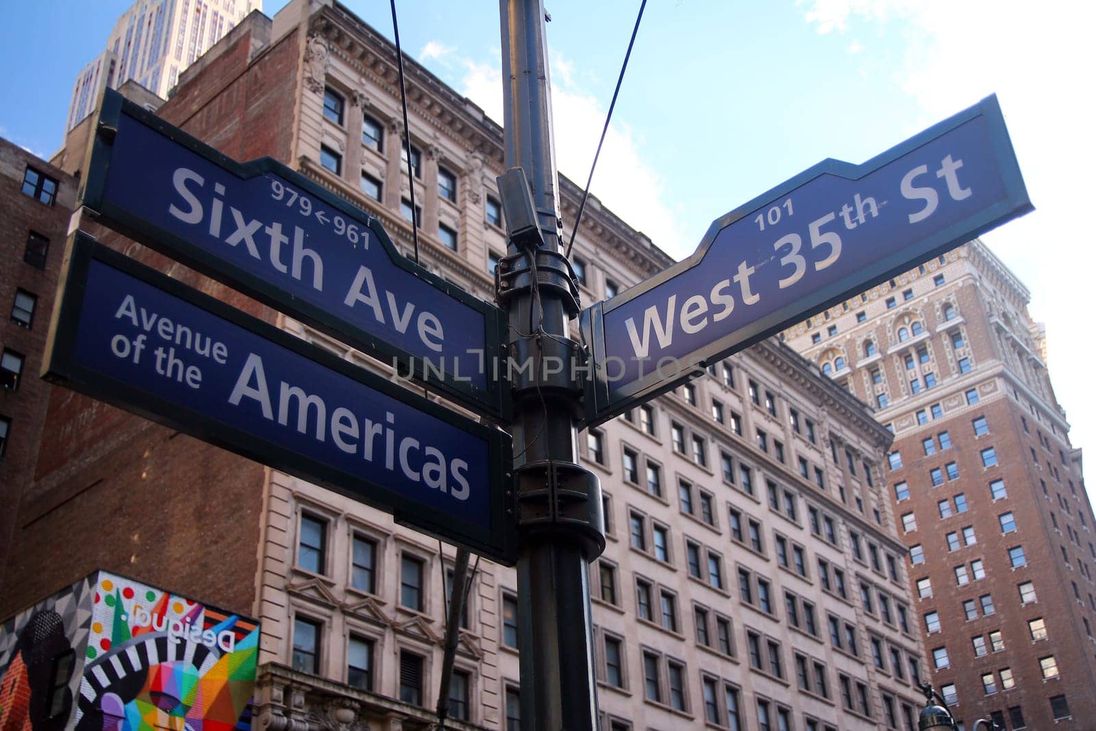 Blue West 35th Street, Broadway and Avenue of the Americas 6th historic sign in Midtown Manhattan in New York City