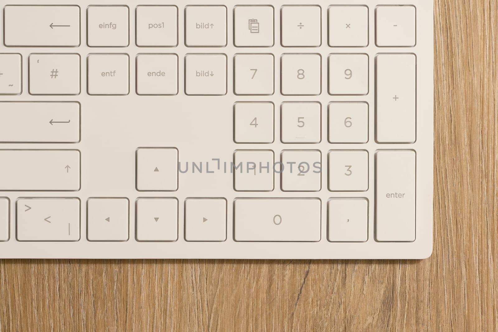 Keyboard from a computer and a computer mouse on a desk in the office