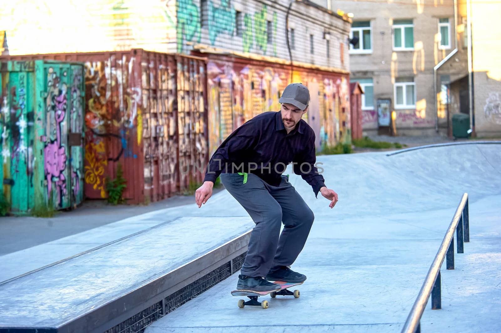 skateboarder prepares to jump on the parapet. High quality photo
