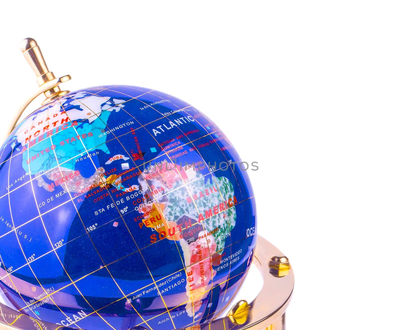 The blue glass globe on the yellow shiny metal stand isolated on white background
