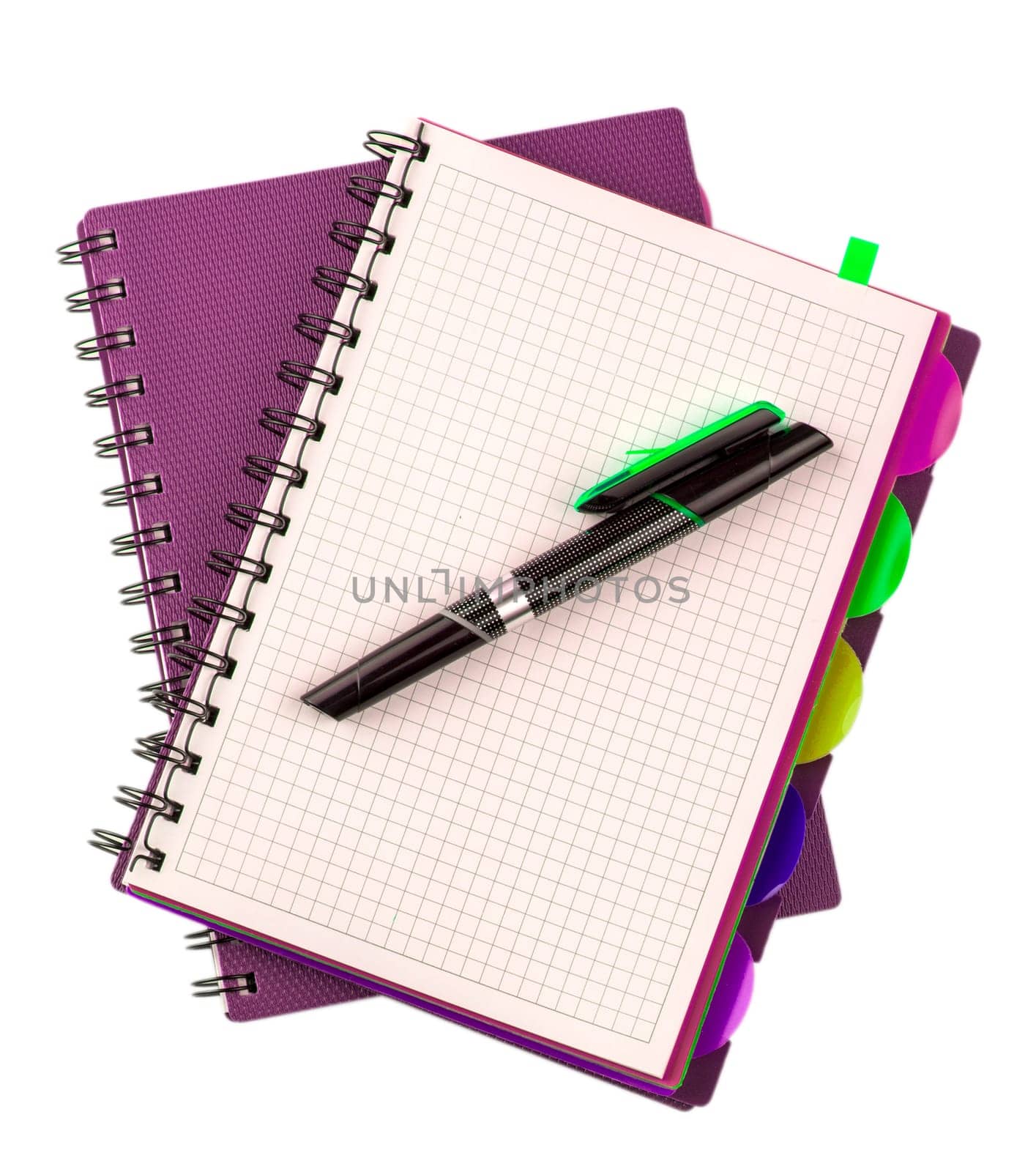 The pink diary spiral notebookes and black pen isolated on white background
