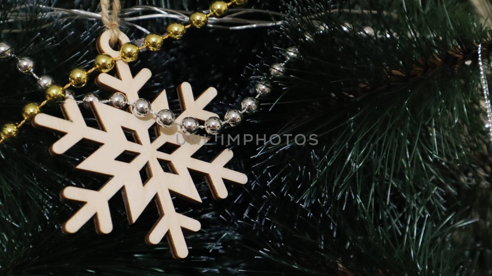 Close-up of a Christmas background. Celebration. Christmas tree with toys and decorative snow for a happy new year. Christmas decorations, New Year's atmosphere. Beautiful modern postcard