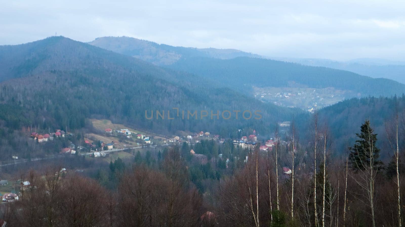 Colorful autumn landscape in a mountain village. Misty morning in the Carpathians. Ukraine, Europe. Beautiful hills and houses. World of beauty. Mountain view in the fall. Beautiful natural landscape