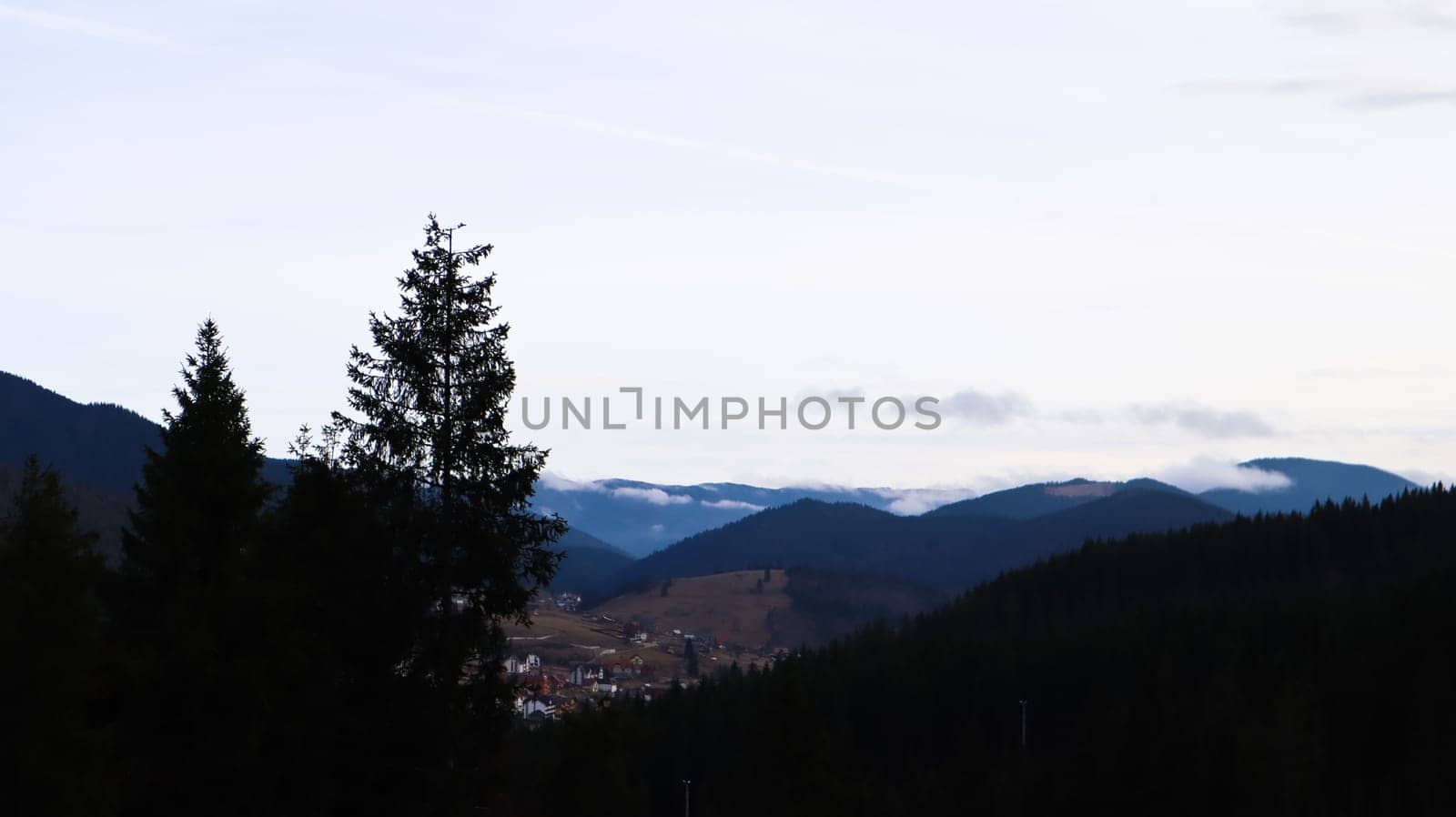 Colorful autumn landscape in the Carpathian mountains with mountain peaks. Carpathians, Ukraine, Europe. World of beauty. Forest with orange leaves. Autumn sunny day in western Ukraine