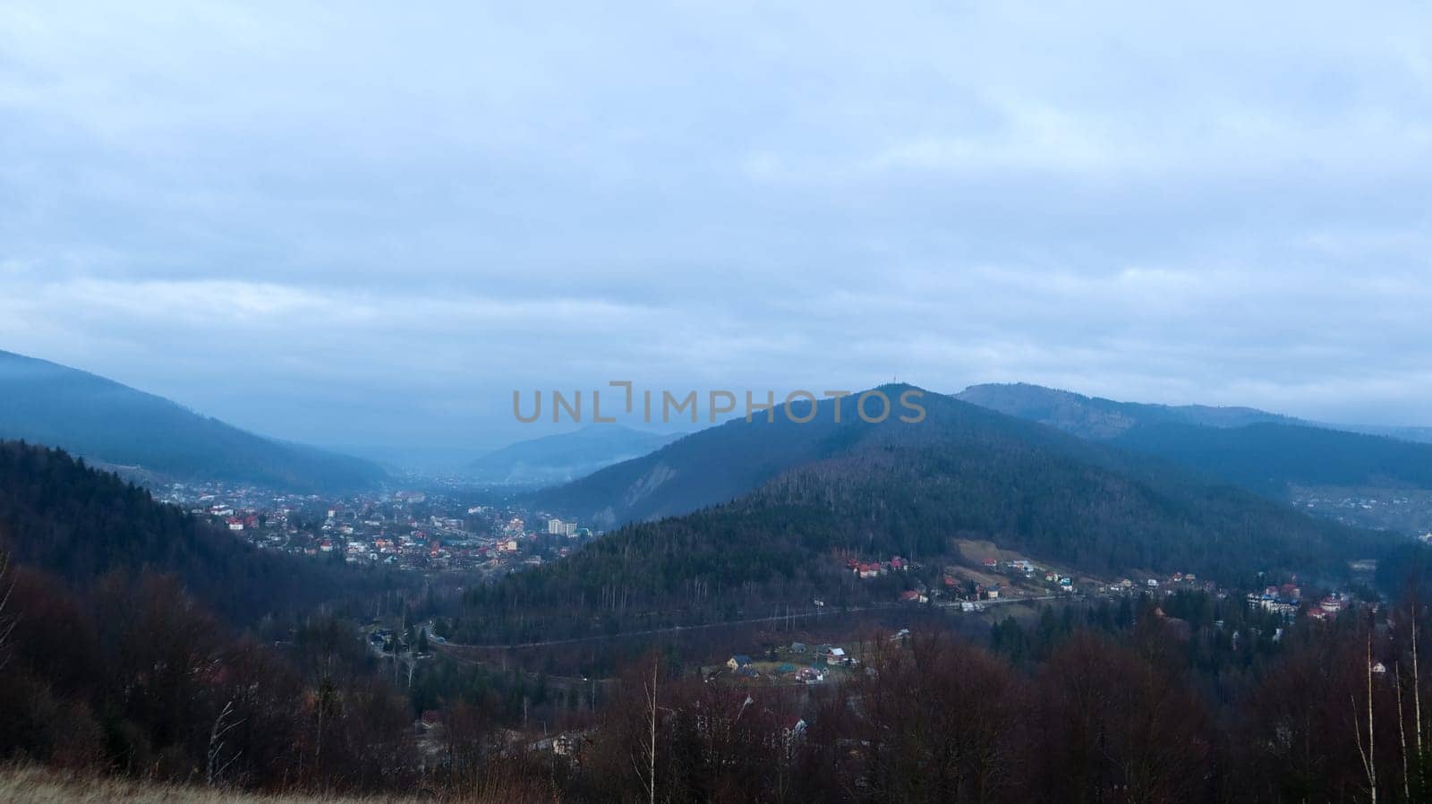 Colorful autumn landscape in a mountain village. Misty morning in the Carpathians. Ukraine, Europe. Beautiful hills and houses. World of beauty. Mountain view in the fall. Beautiful natural landscape