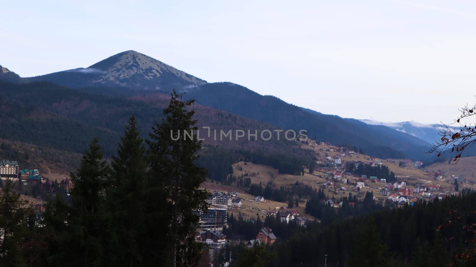 Colorful autumn landscape in a mountain village. Misty morning in the Carpathians. Ukraine, Europe. Beautiful hills and houses. World of beauty. Mountain view in the fall. Beautiful natural landscape