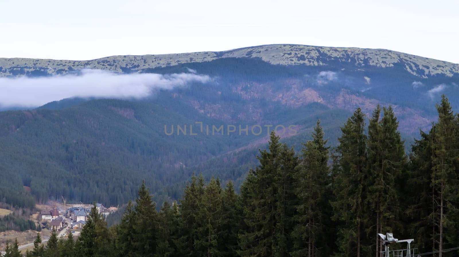 Autumn landscape in the Carpathians with mountain peaks and pine forest in western Ukraine. Carpathians, Ukraine, Europe. World of beauty