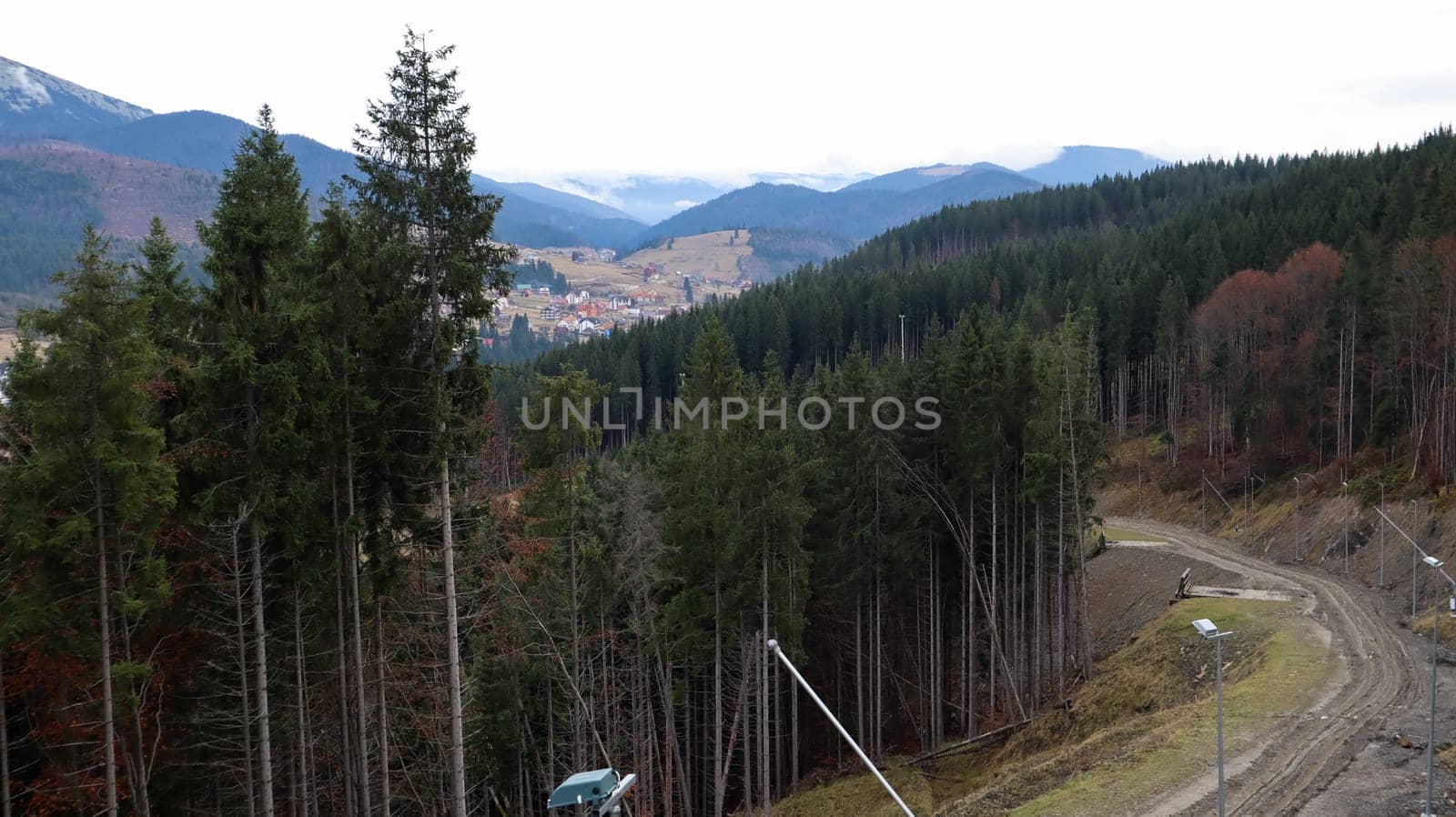Colorful autumn landscape in the Carpathian mountains with mountain peaks. Carpathians, Ukraine, Europe. World of beauty. Forest with orange leaves. Autumn sunny day in western Ukraine