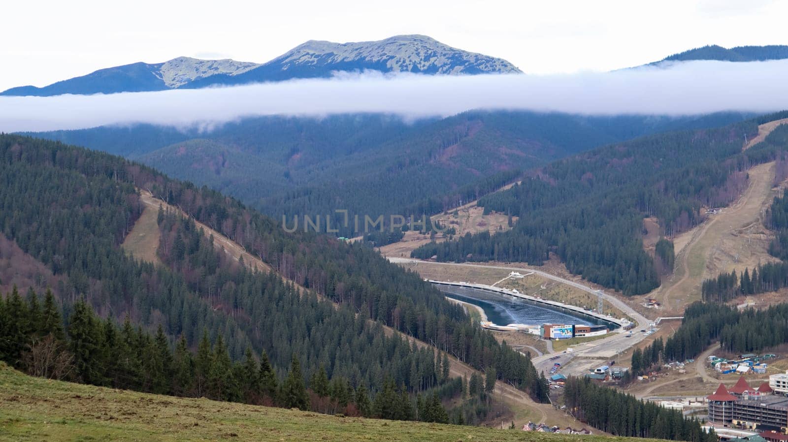 Bukovel ski resort in autumn aerial view. View of hotel houses in the ecological countryside against the background of spruce trees and mountain hills.Ukraine, Bukovel - November 20, 2019